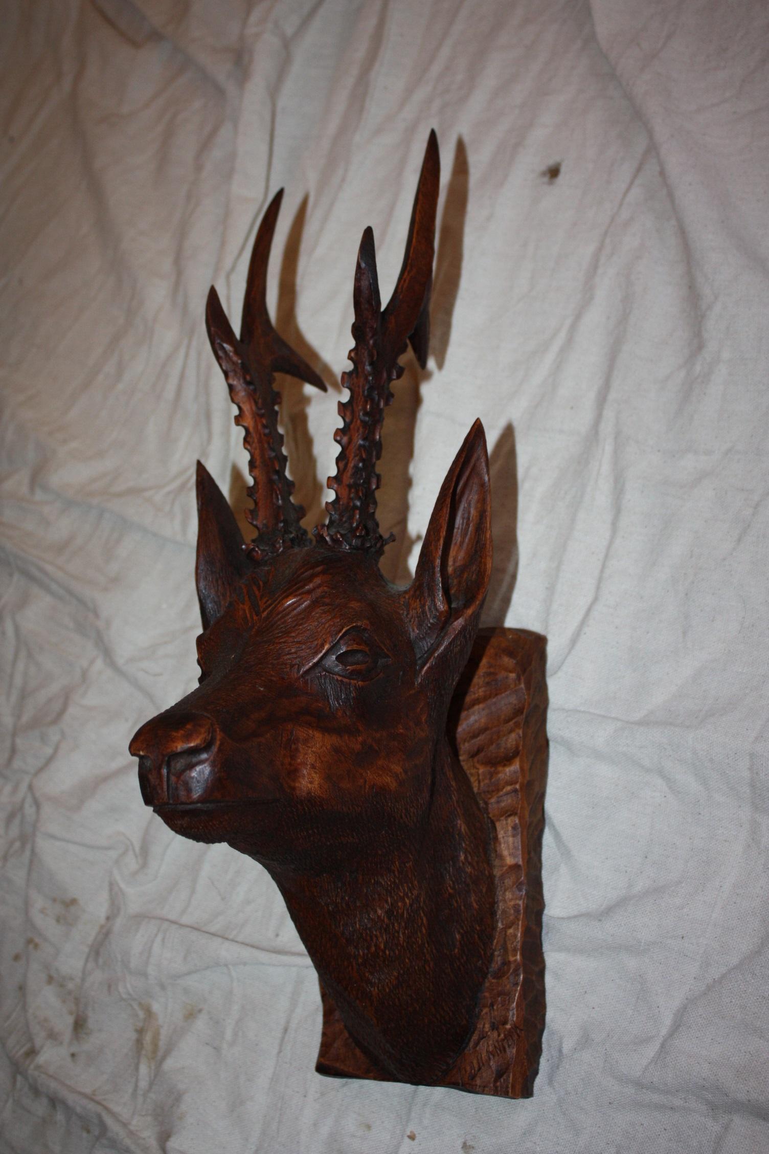 Black forest carved wood deer head.