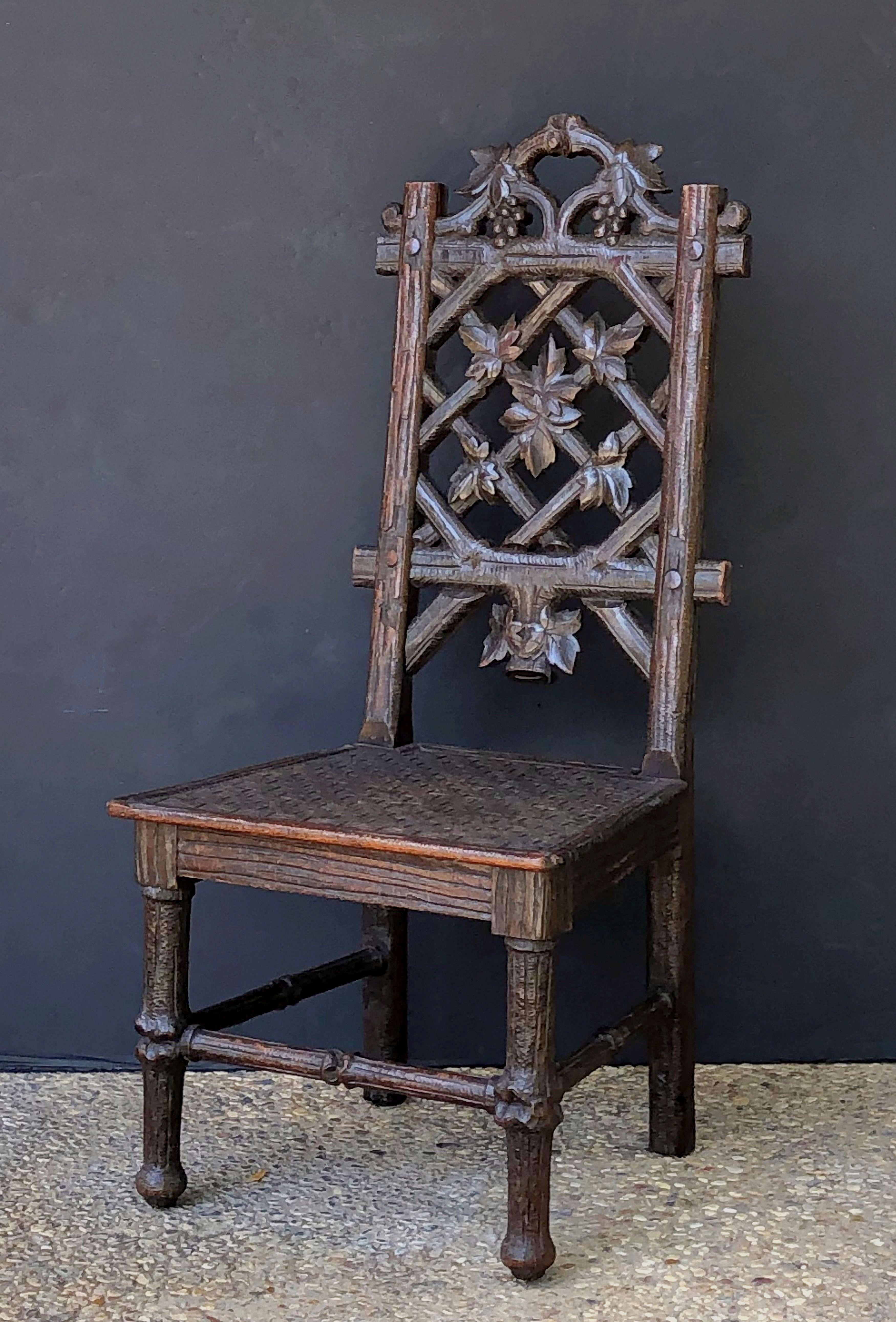 Swiss Black Forest Chair of Carved Oak from the 19th Century