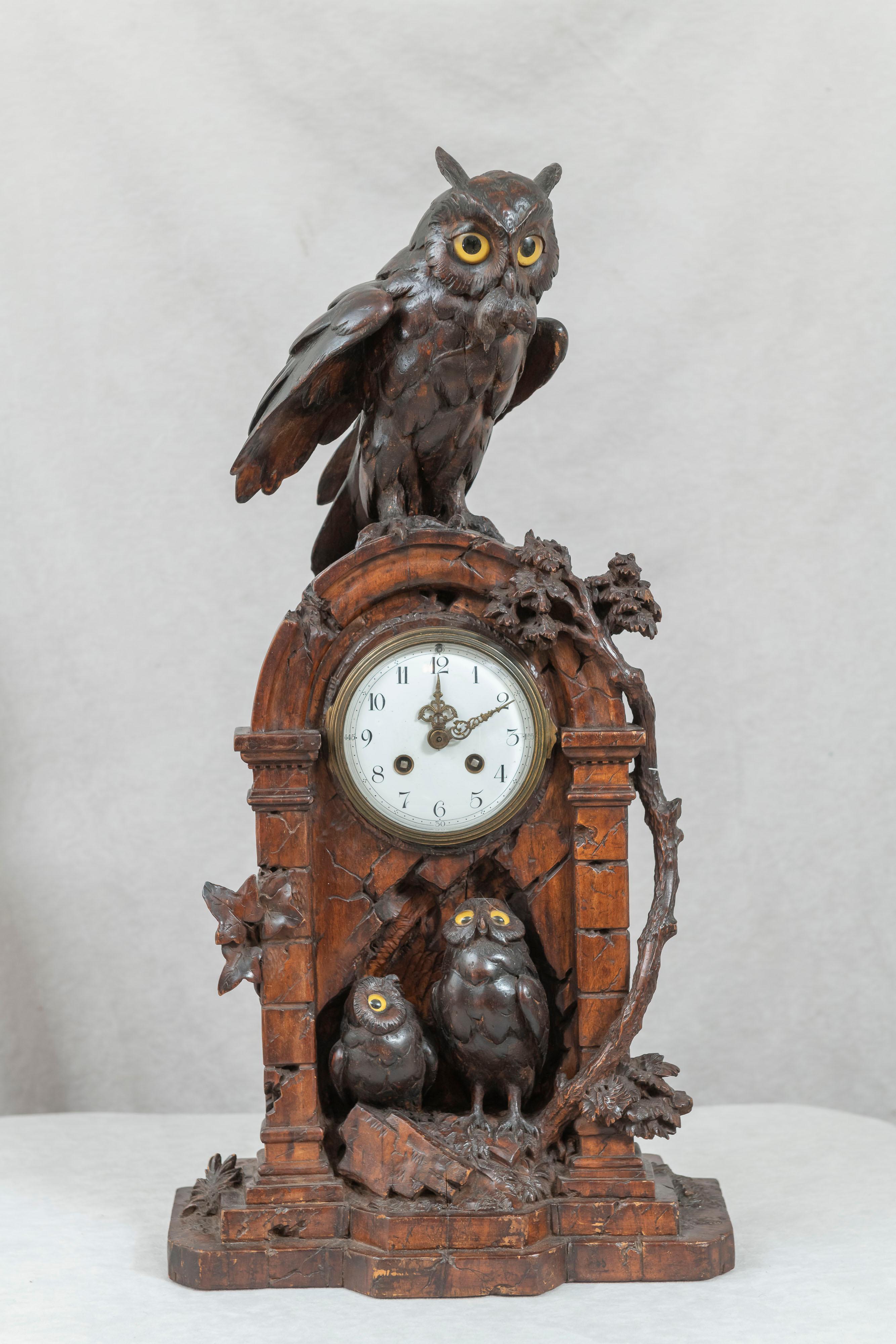 Offering here a wonderfully humorous and adorable Black Forest clock. The mother owl sits atop the clock with todays meal in her mouth as her little ones look above longing for today's chow. I can't remember seeing any Black Forest items with such