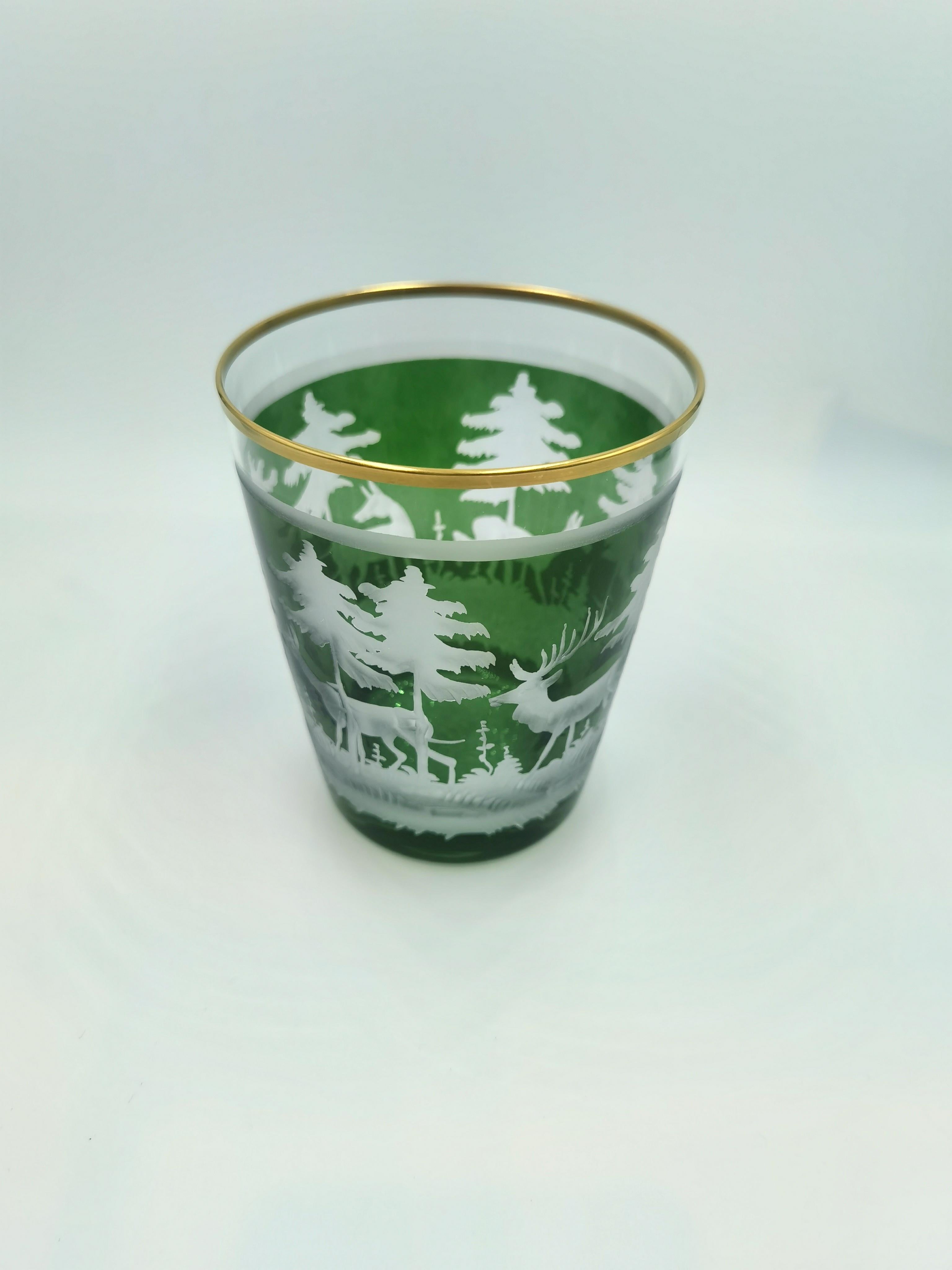 Hand blown crystal latern in green crystal glass from Bavaria Germany. The decor is hands-free engraved by glass artists all around with a hunting scene with trees in the style of Black Forest. Rimmed with a 24 carat gold line. Sofina glass and