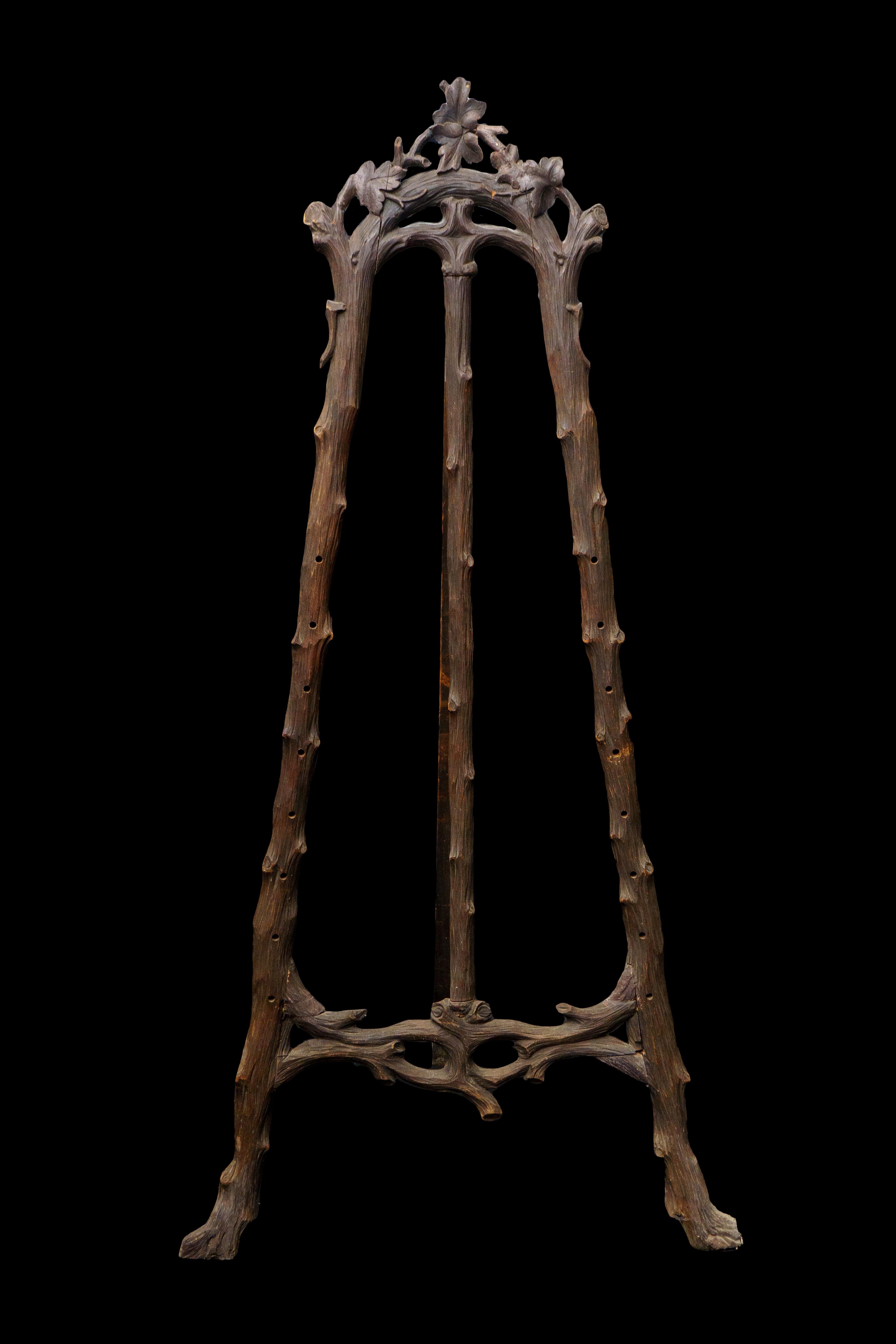 19th Century Black forest Easel. Beautifully carved branches and leaves make this the ideal way to display your most treasured painting.

Measures: 37