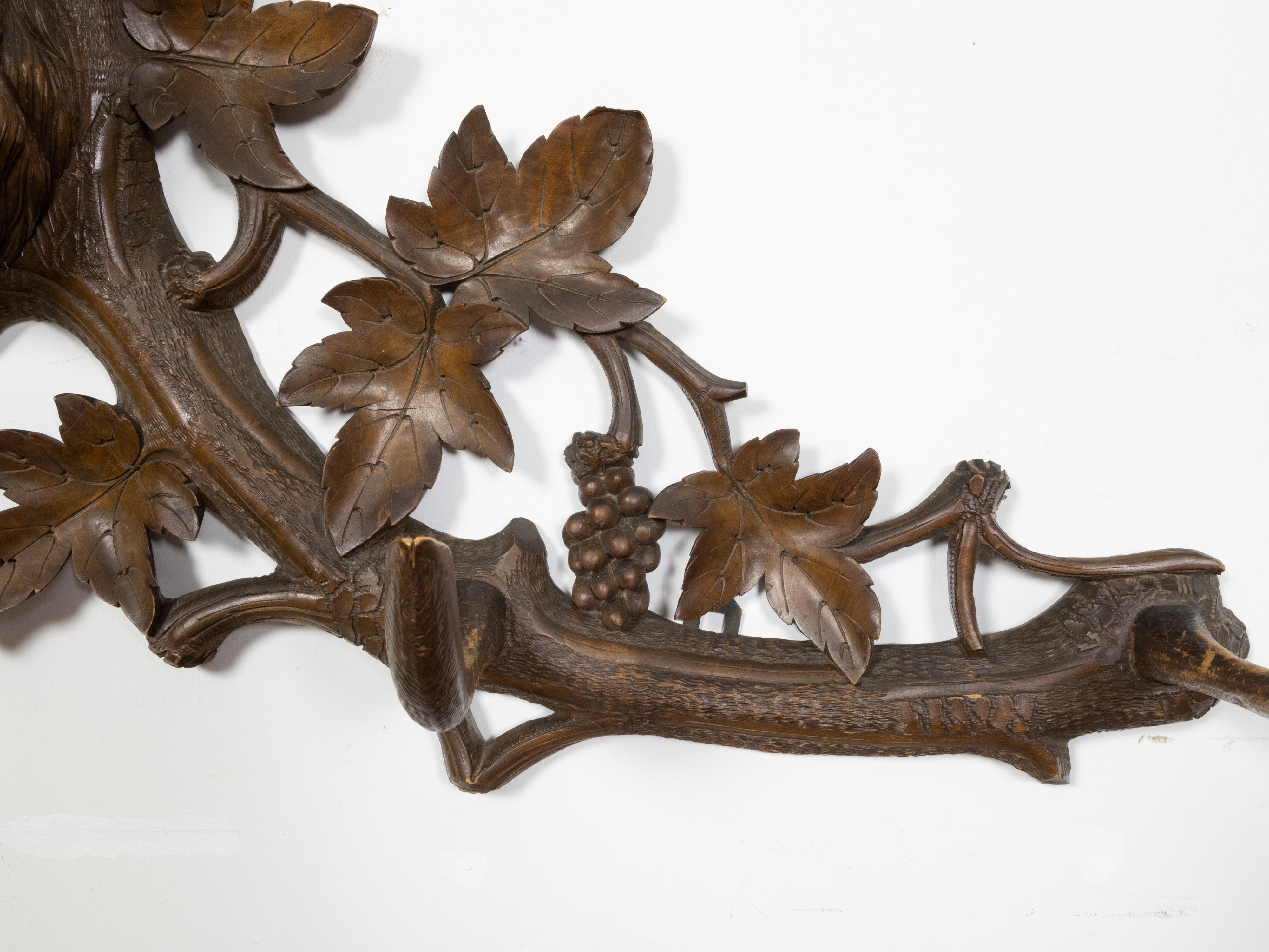 20th Century Black Forest Four-Hook Coat Hanger with Hand-Carved Stag Head and Grapevines