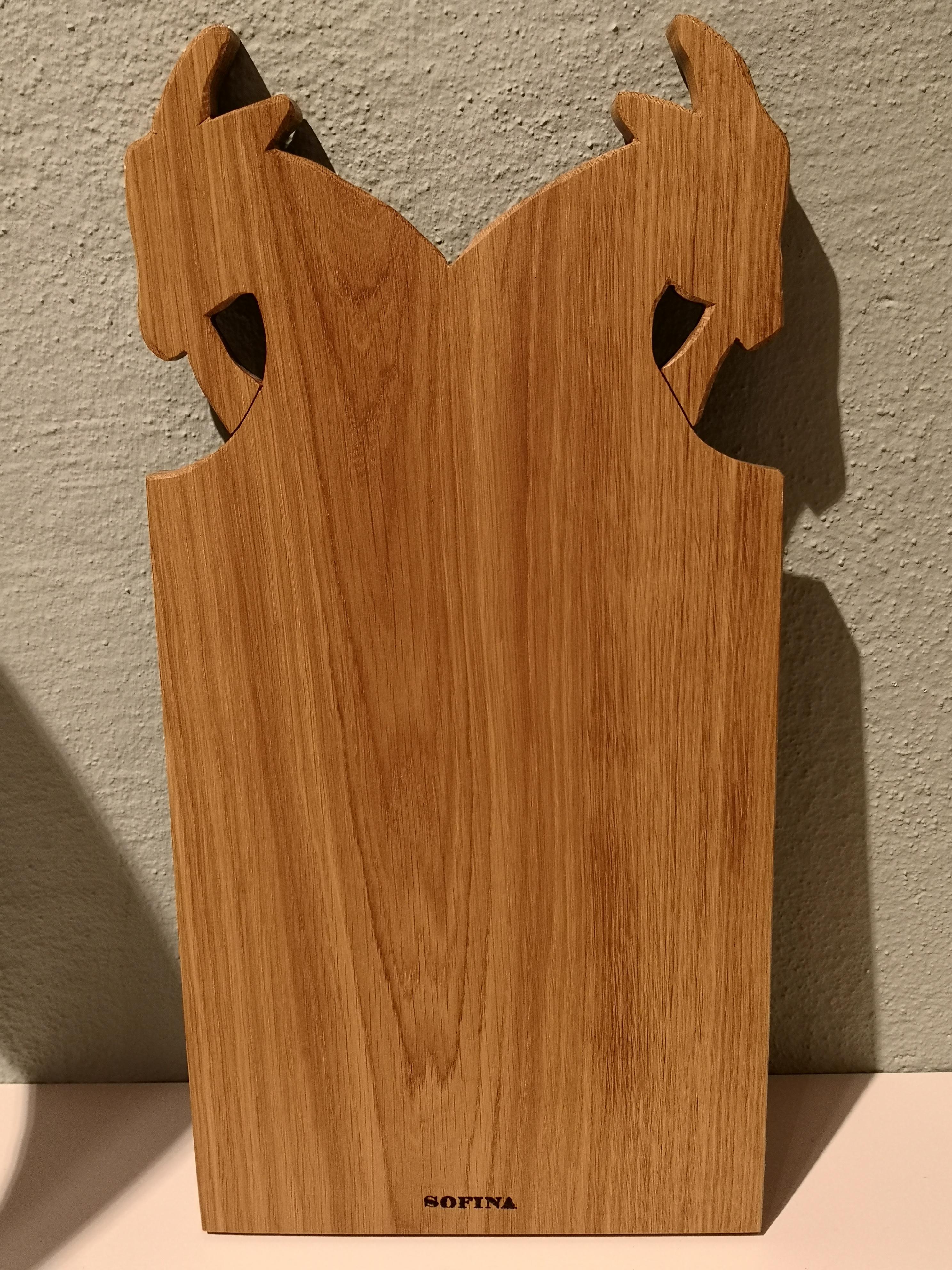 Completely hand carved cut board in Black Forest style with two goat heads on top. The cutboards are cut by hand in solid oakwood with our SOFINA brand logo backside.
Beautiful serving piece for cheese and sausage on any table or buffet. Comes in