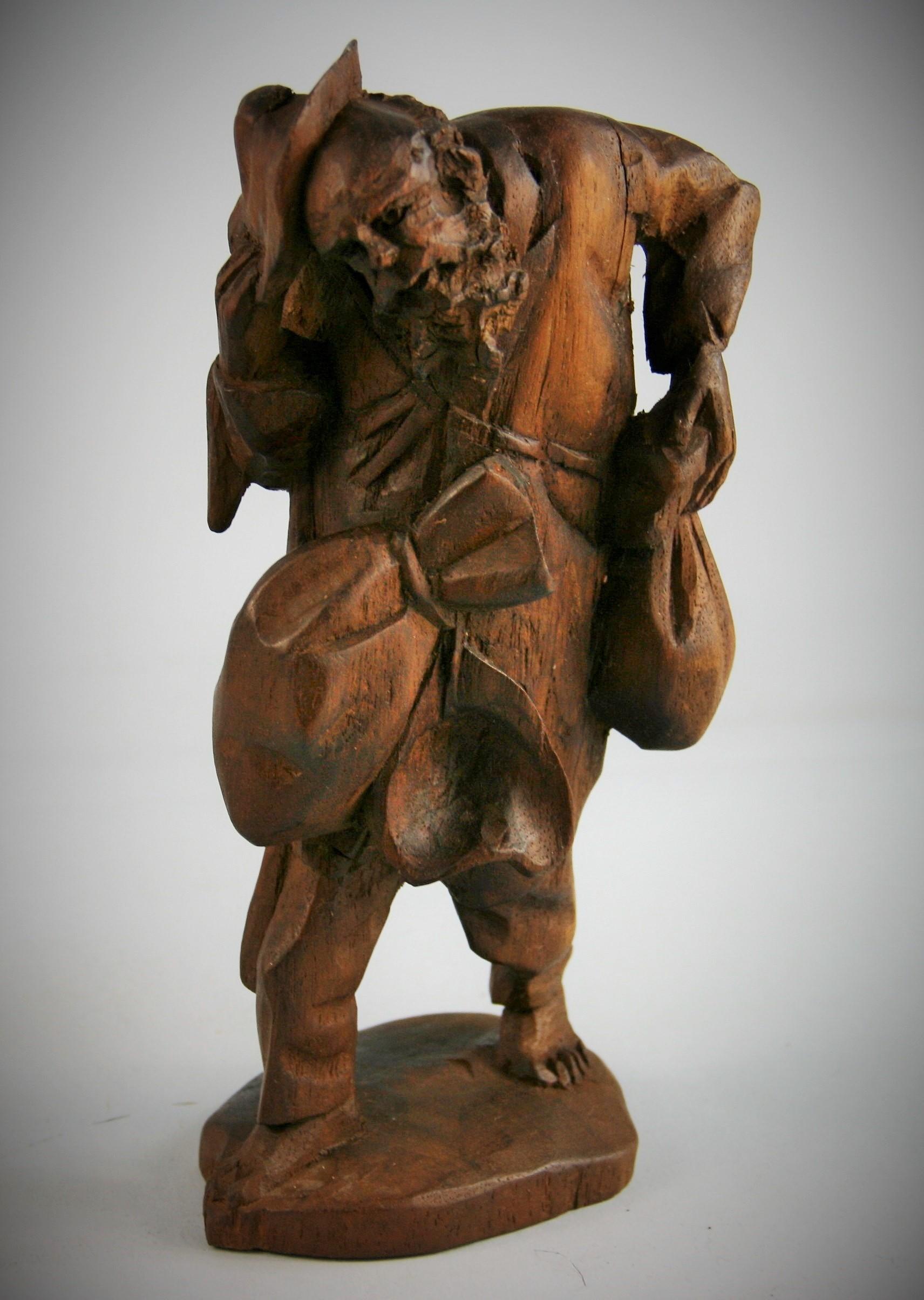3-634 Black Forest German hand carved walnut traveler figural sculpture.