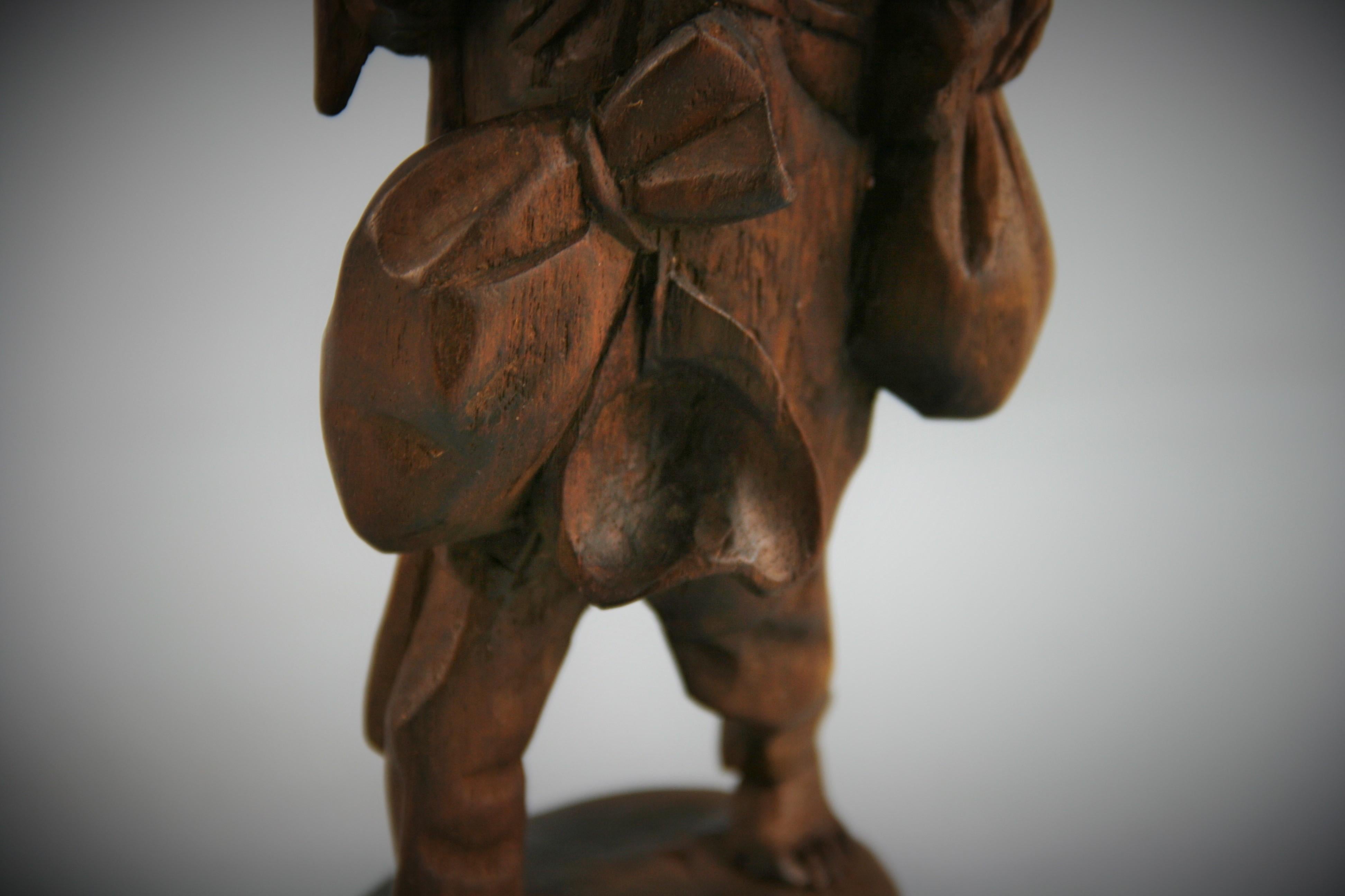 Early 20th Century Black Forest Hand Carved Walnut Figural Traveler Sculpture For Sale