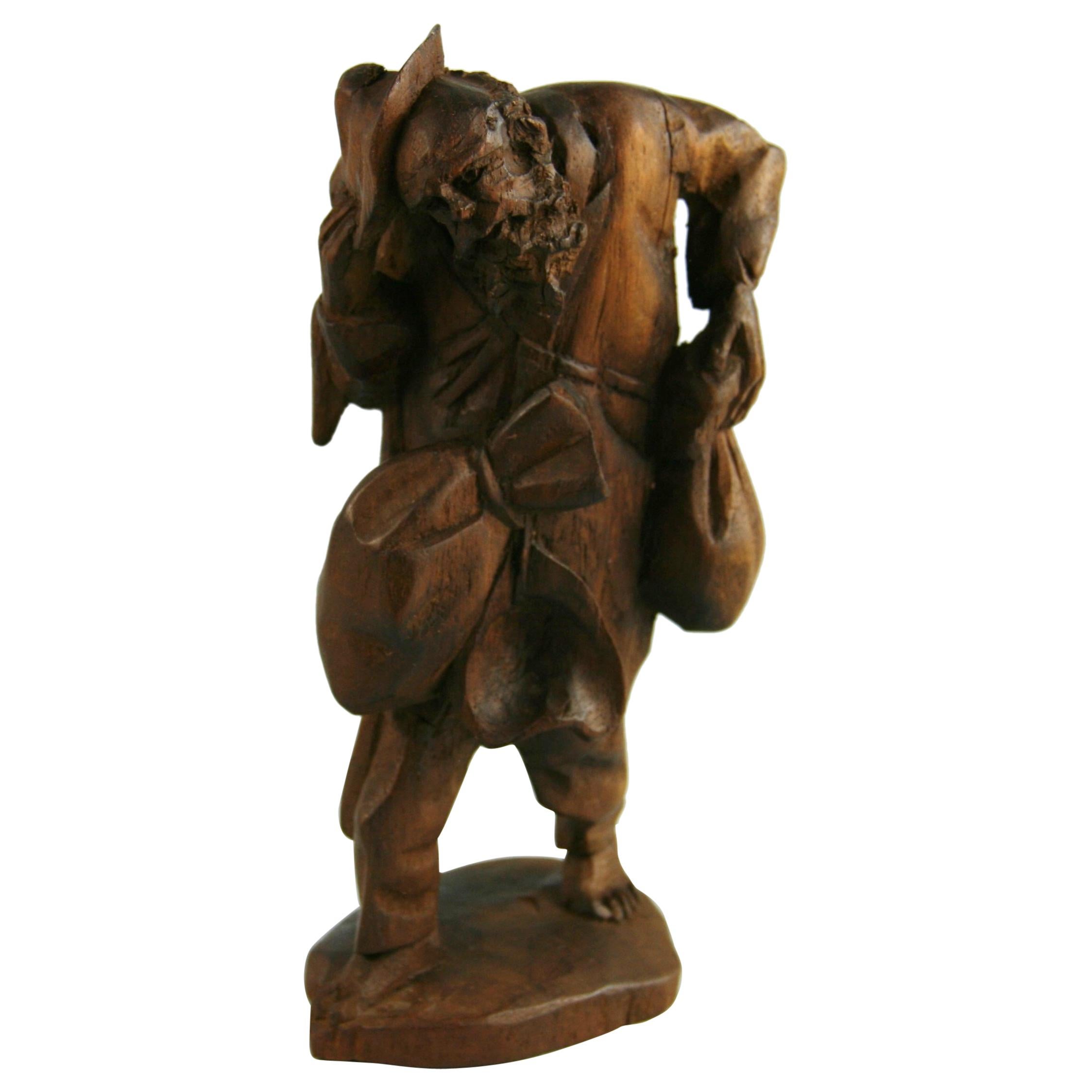 Black Forest Hand Carved Walnut Figural Traveler Sculpture