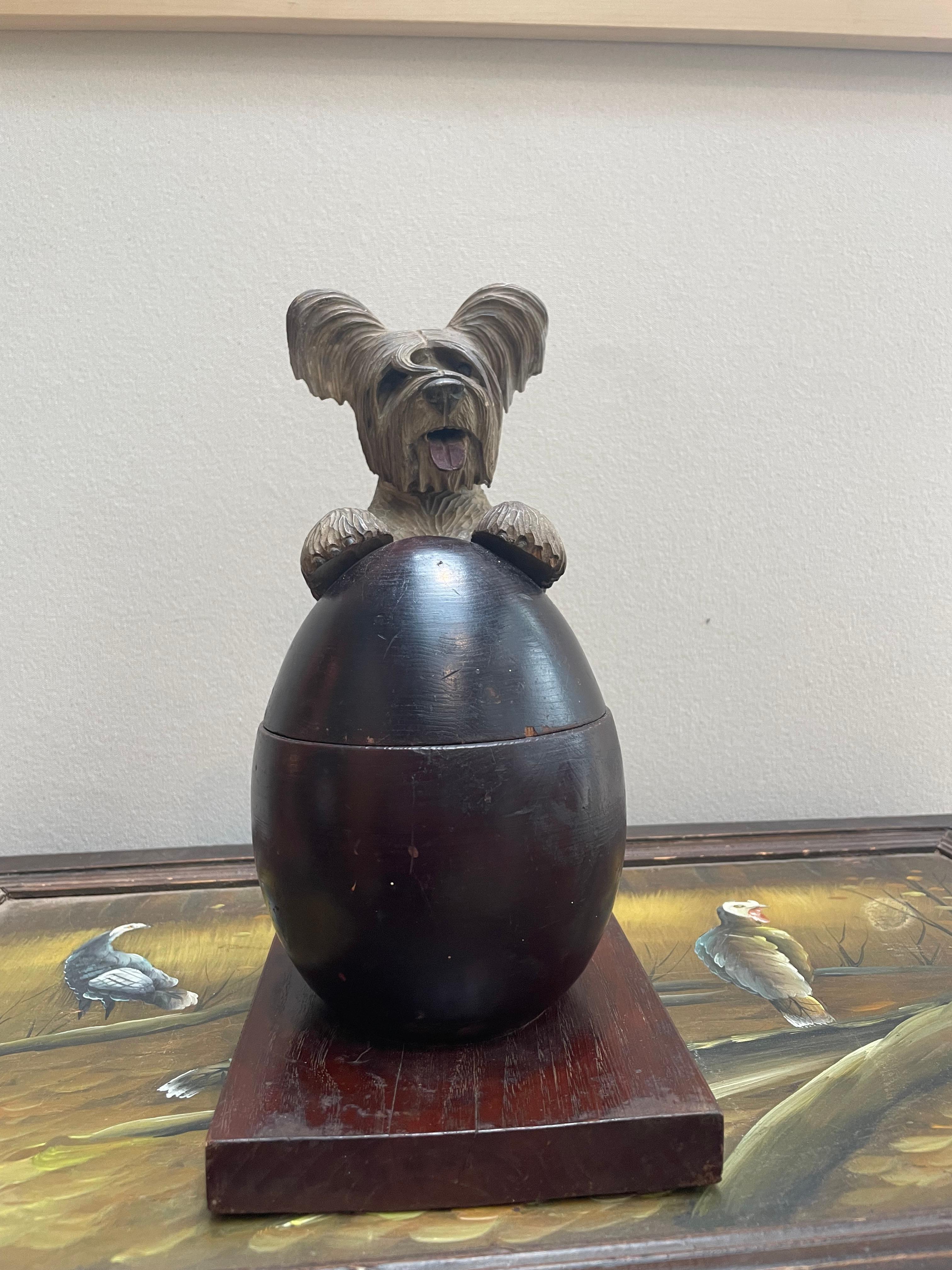 This is a joyful novelty- a Black Forest hand-carved Terrier box. A beautifully executed piece with exceptional detail, right down to the tail. This terrier’s hind legs are attached to the base with a spring mechanism so when you pull the body back,