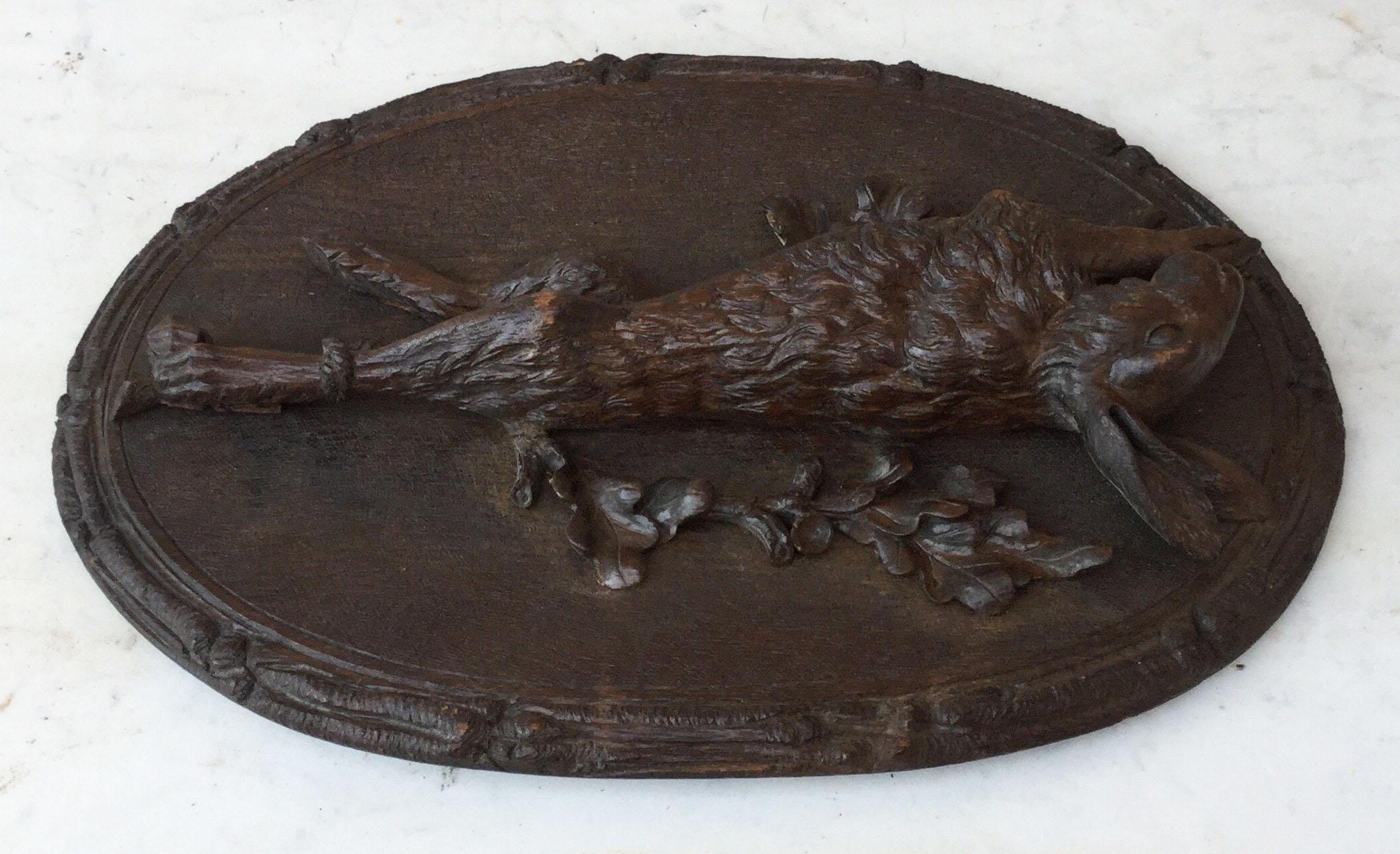 Fine Black Forest carved wood wall plaque on a medallion with a hare or jackrabbit on oak leaves circa 1880.
Carved oakwood.