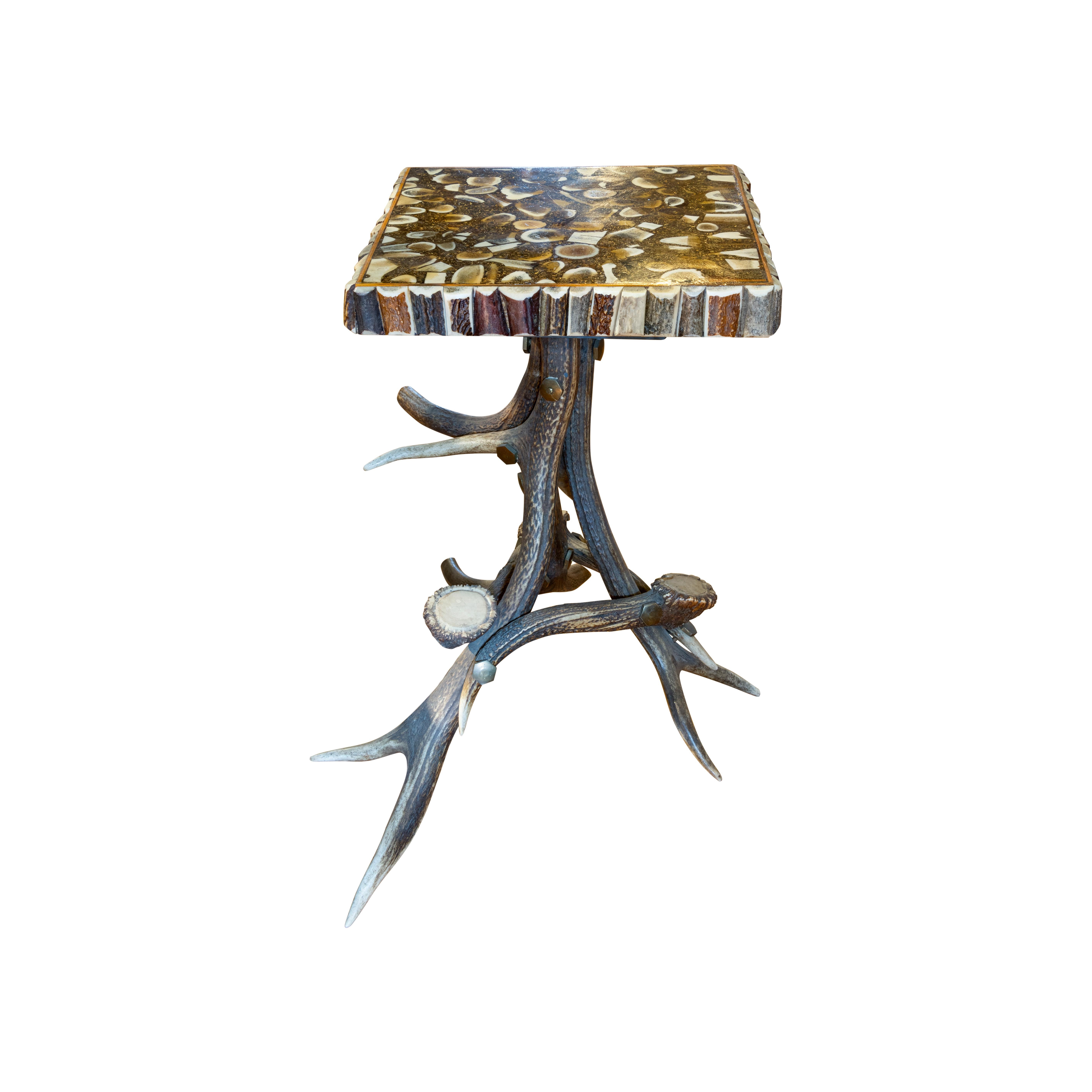 Black Forest horn table with 4 matching stools. Table size. Stools are 13