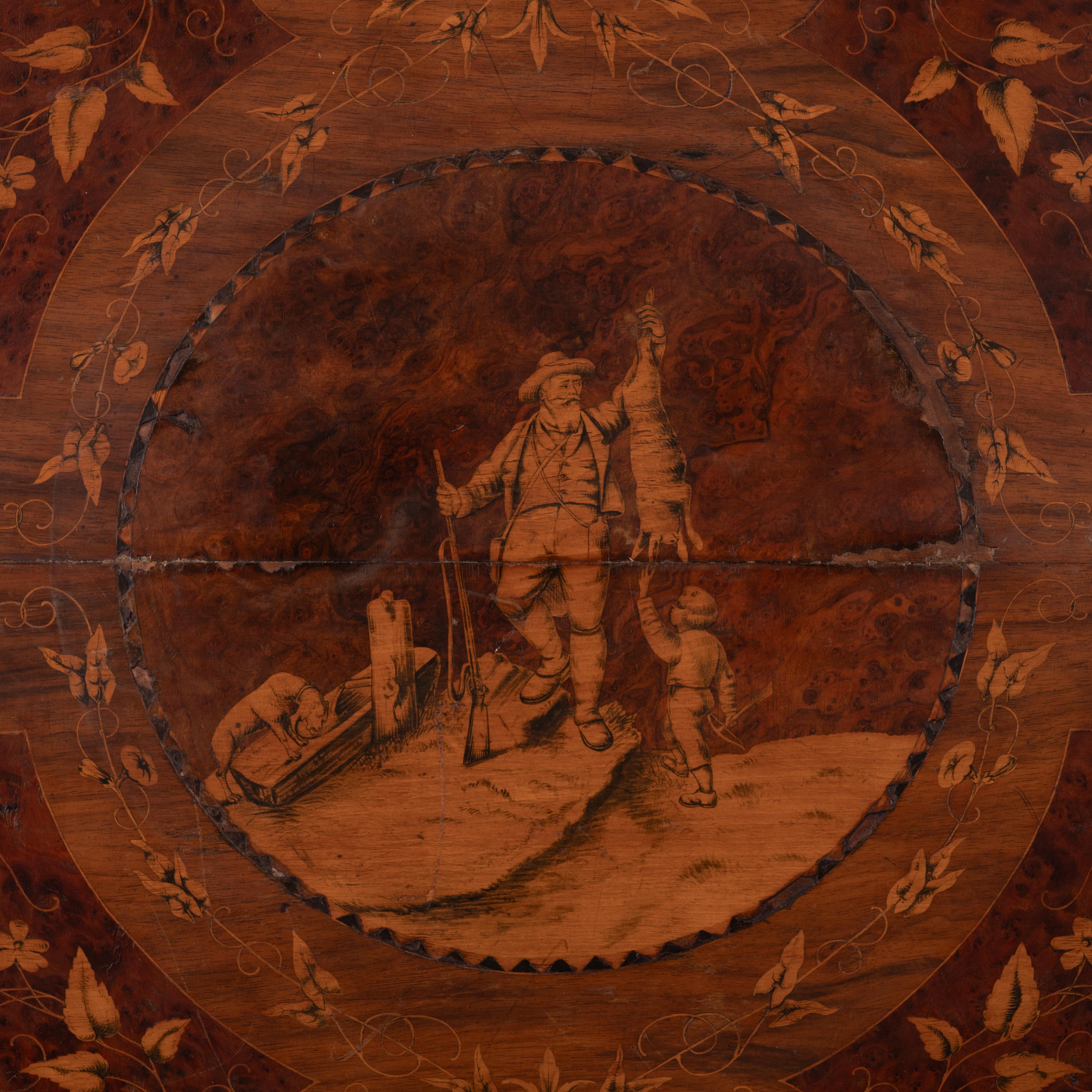 A Black Forest marquetry hunt scene table top wall-hanging, 19th century.

36 ¼ by 27 ¼ inches

