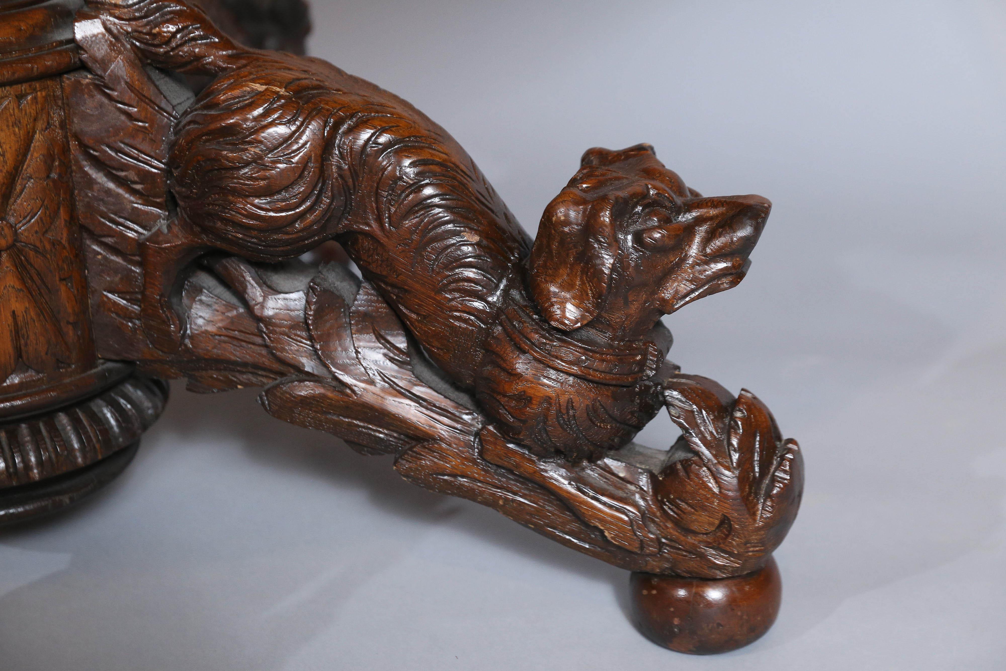 Stained Black Forest Oak and Walnut Oval Centre Table with Carved Animals For Sale