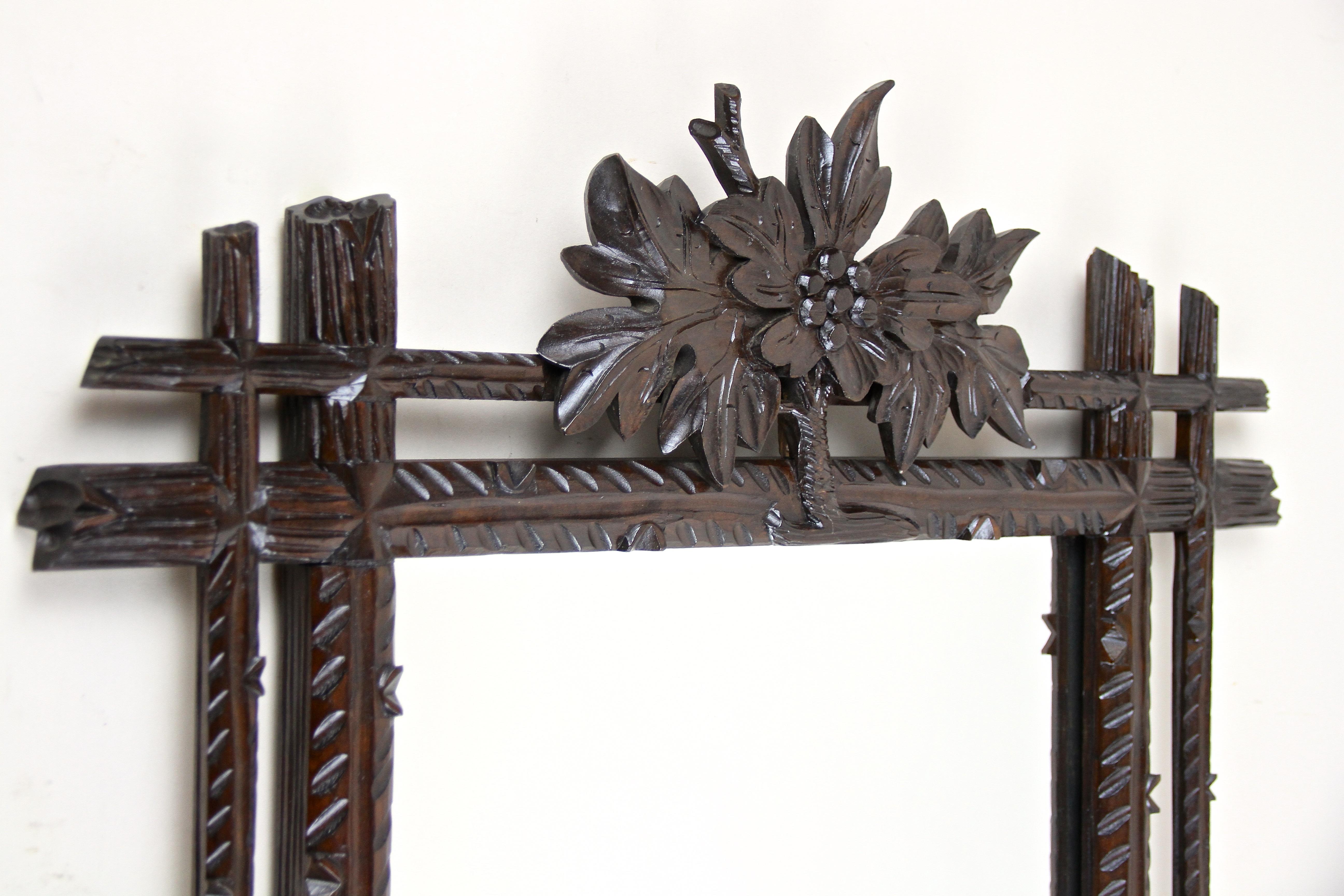 Hand-Carved Black Forest Rustic Wall Mirror with Center Top Carving, Austria, circa 1890 For Sale