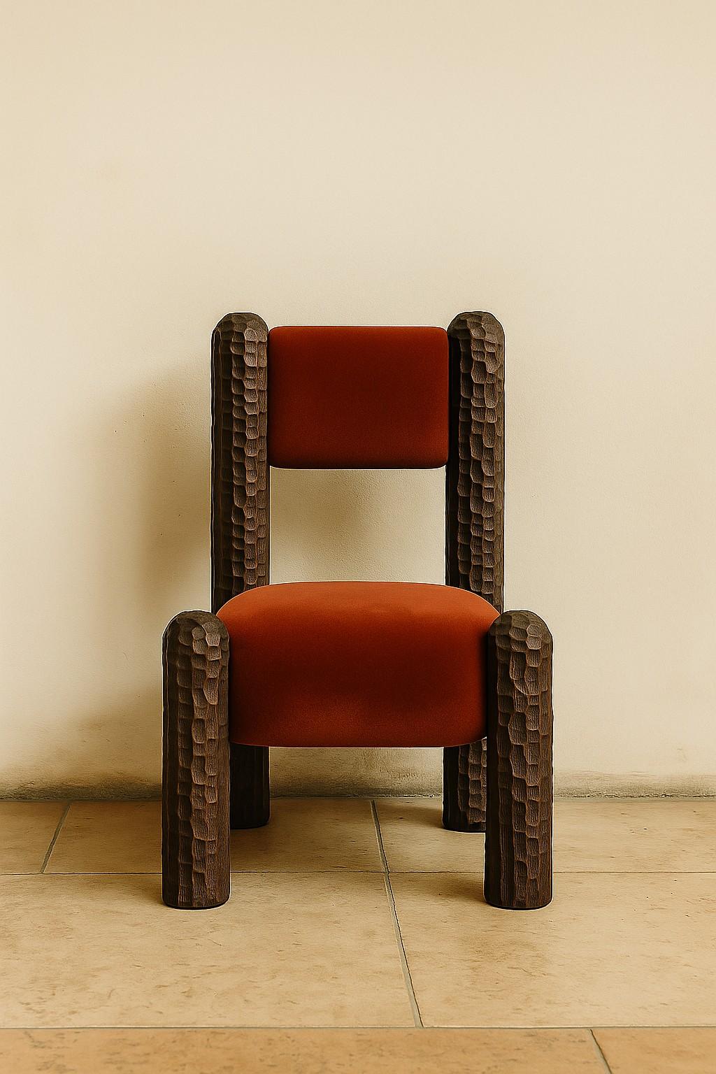 A sculptural statement piece rooted in nature, the Black Forest lounge chair is defined by its bold, hand-carved legs—monumental forms that evoke ancient tree trunks or forest columns. Designed as a tribute to the raw, untamed beauty of the natural