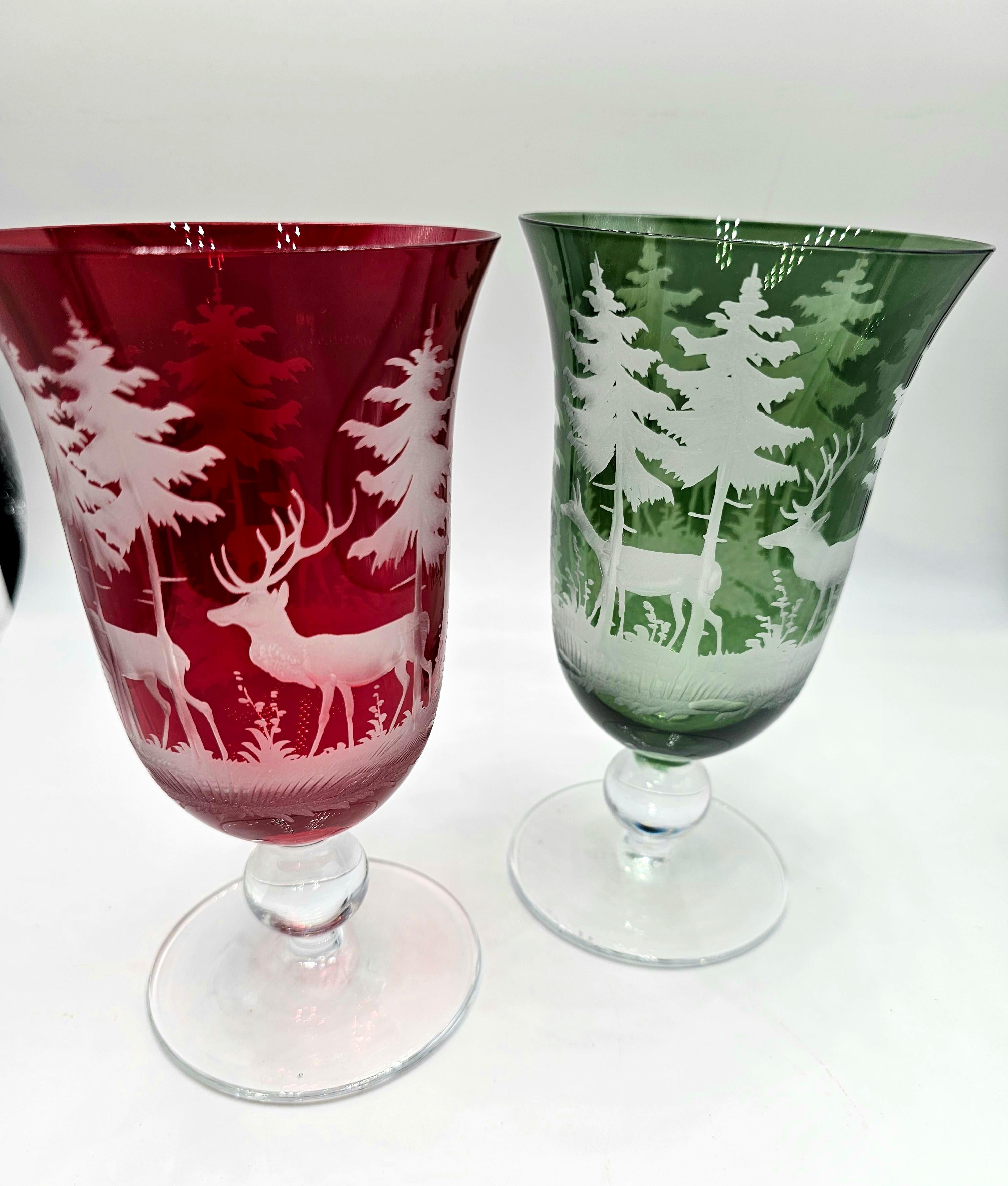 Set of six hand blown wine glasses in red crystal with a hand-edged black forest hunting scene all-around. The decor is an antique hunting scene from Bavaria showing deers, trees and bambis all-over the glass in the style of Black Forest. A glass