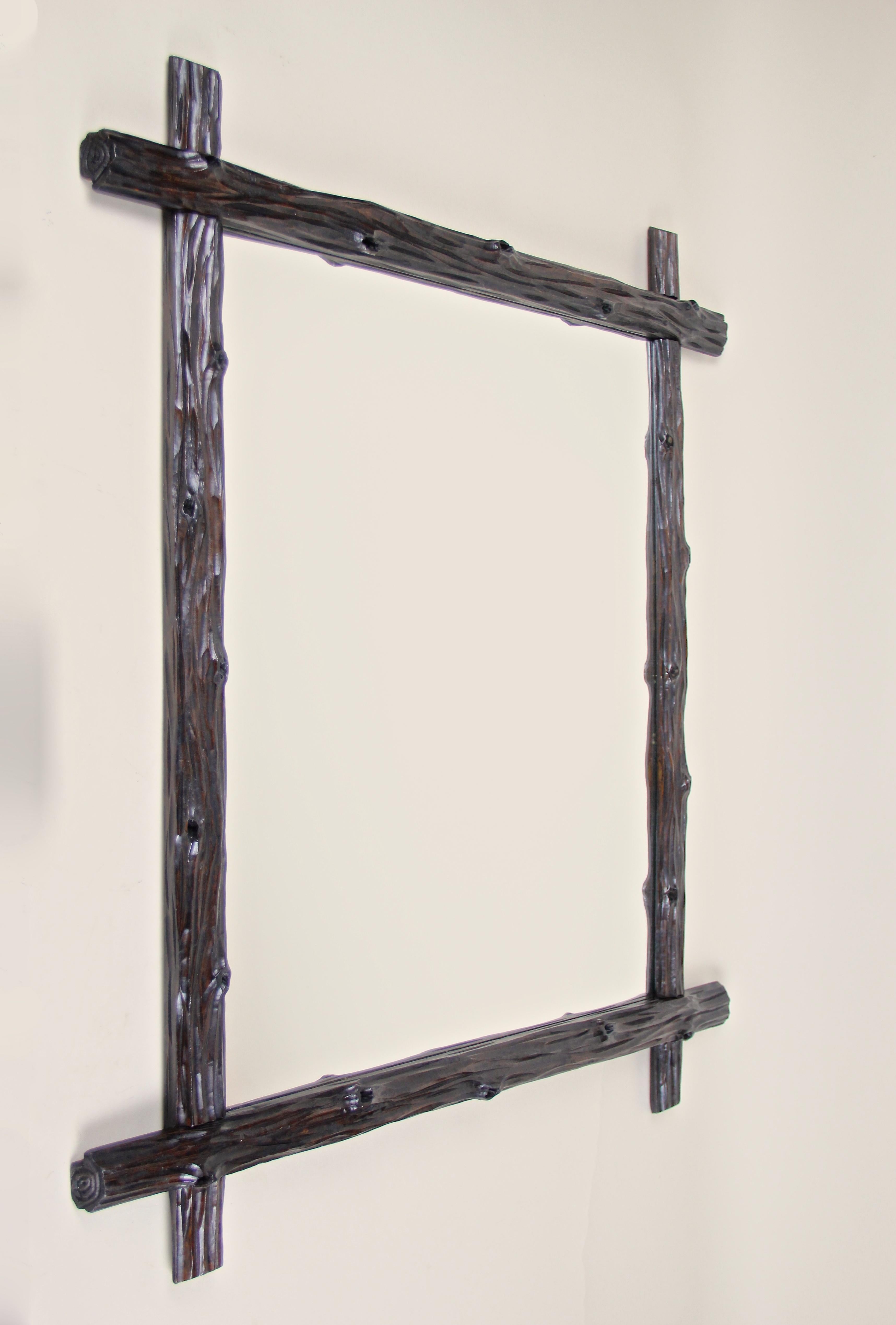 Phenomenal rustic Black Forest wall mirror from Austria, circa 1880. This exceptional antique wall mirror impresses with a simple but elegant 