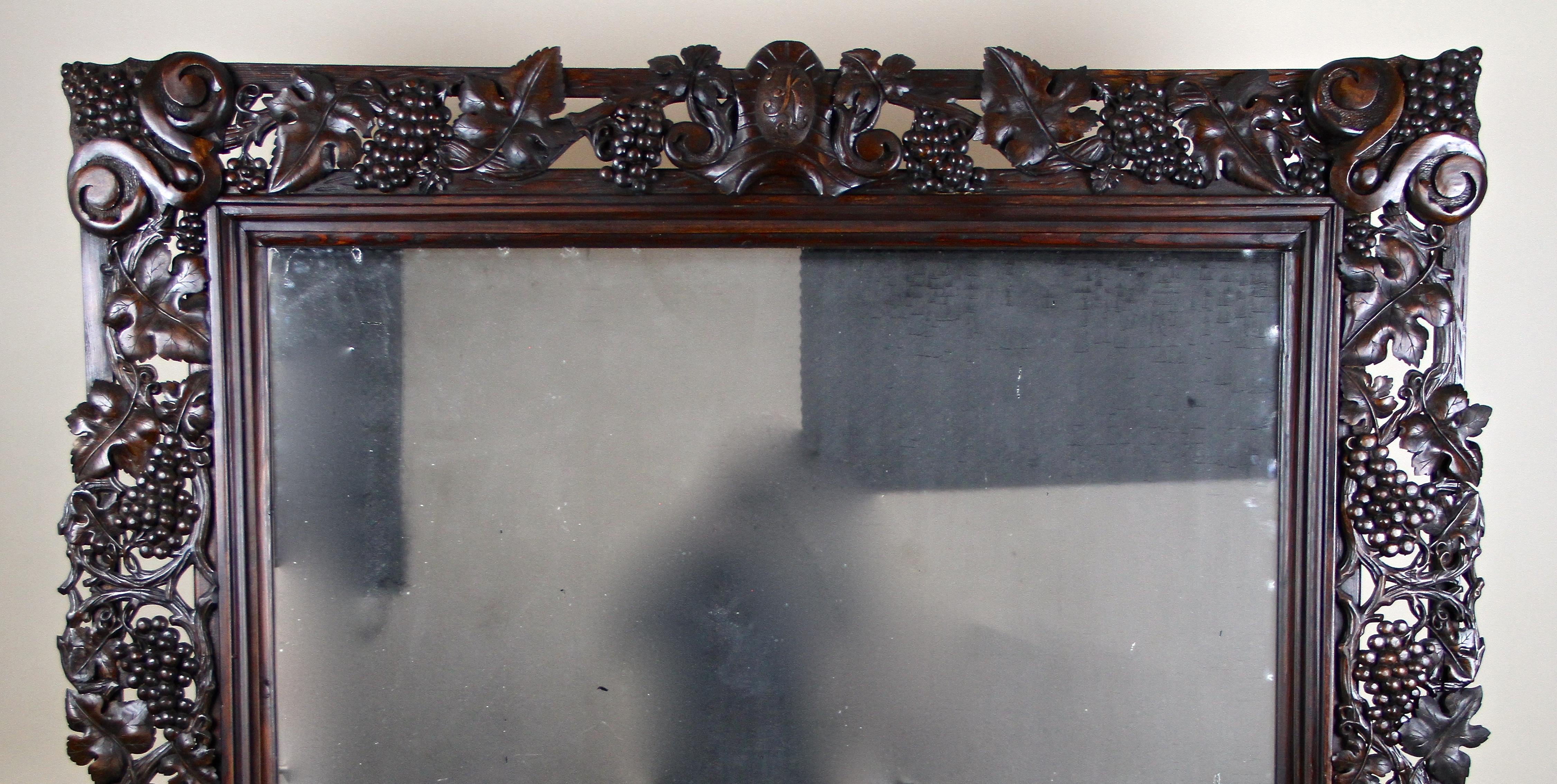 Hand-Carved Black Forest Wall Mirror with Grapes and Leaves Hand Carved, Austria Dated 1919 For Sale