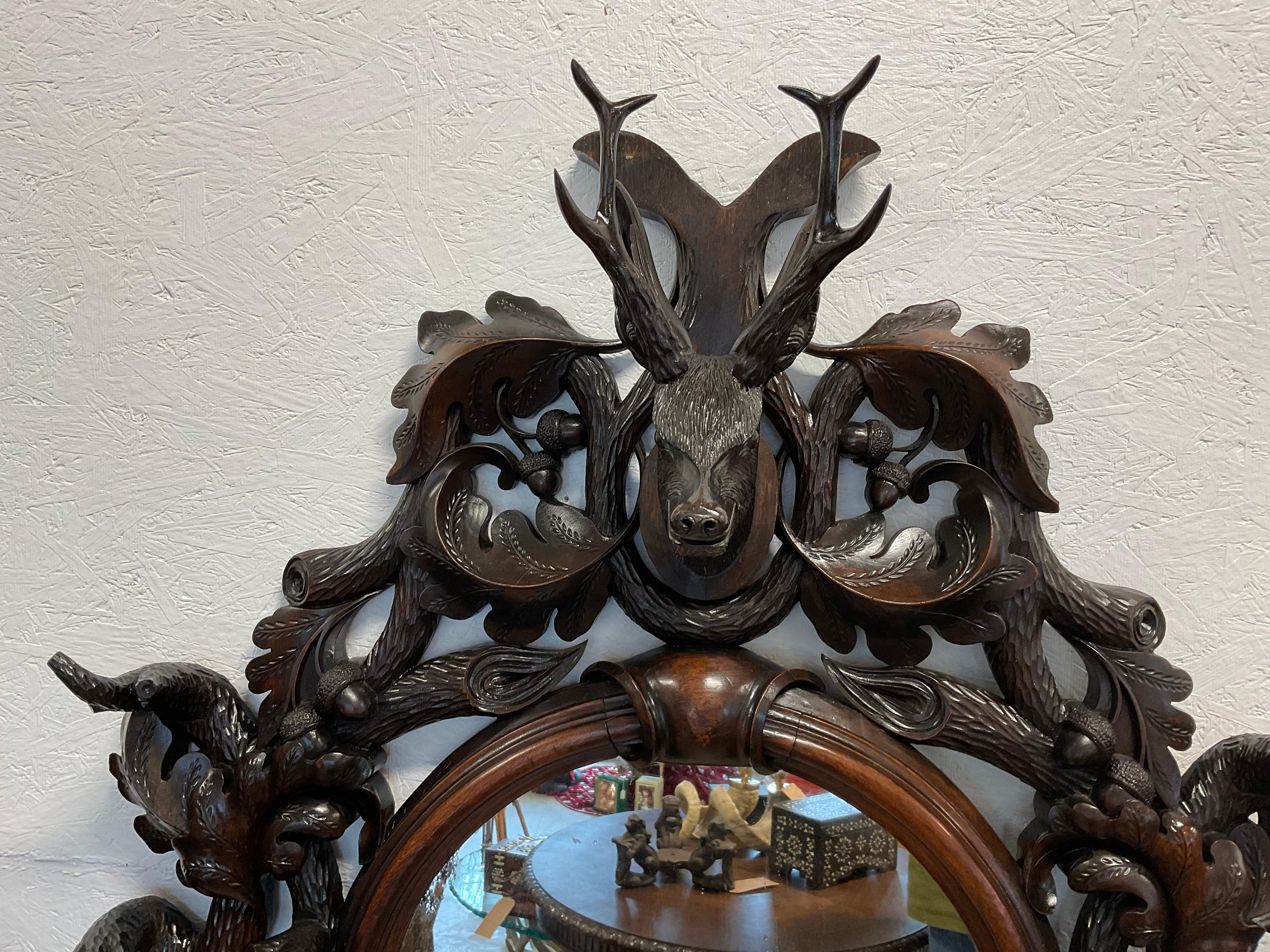 Most unusual size, Black Forest mirror. It was either the upper portion of a hall tree, or the top portion of a a large piece of furniture. It would be ideal, as a mantle mirror. Beautifully carved roe buck, at the top, with large acorns and oak