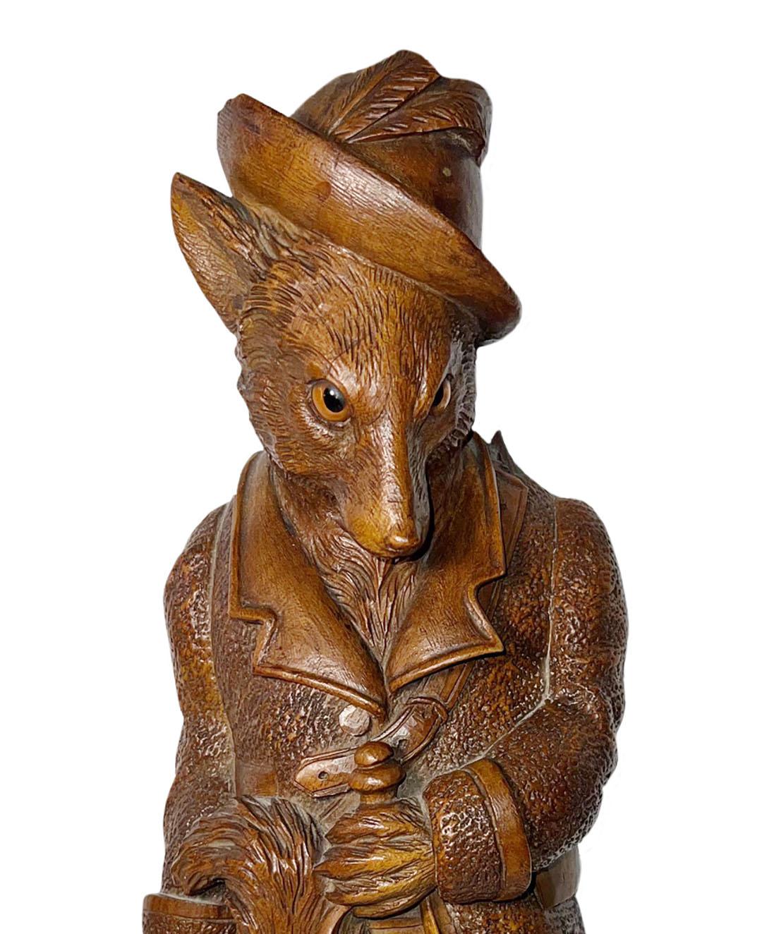 Black Forest, carved wood, whip designed in the shape of a dog wearing a hat and glass eyes. Attached to the back is a music box. Circa 1870, Switzerland. 