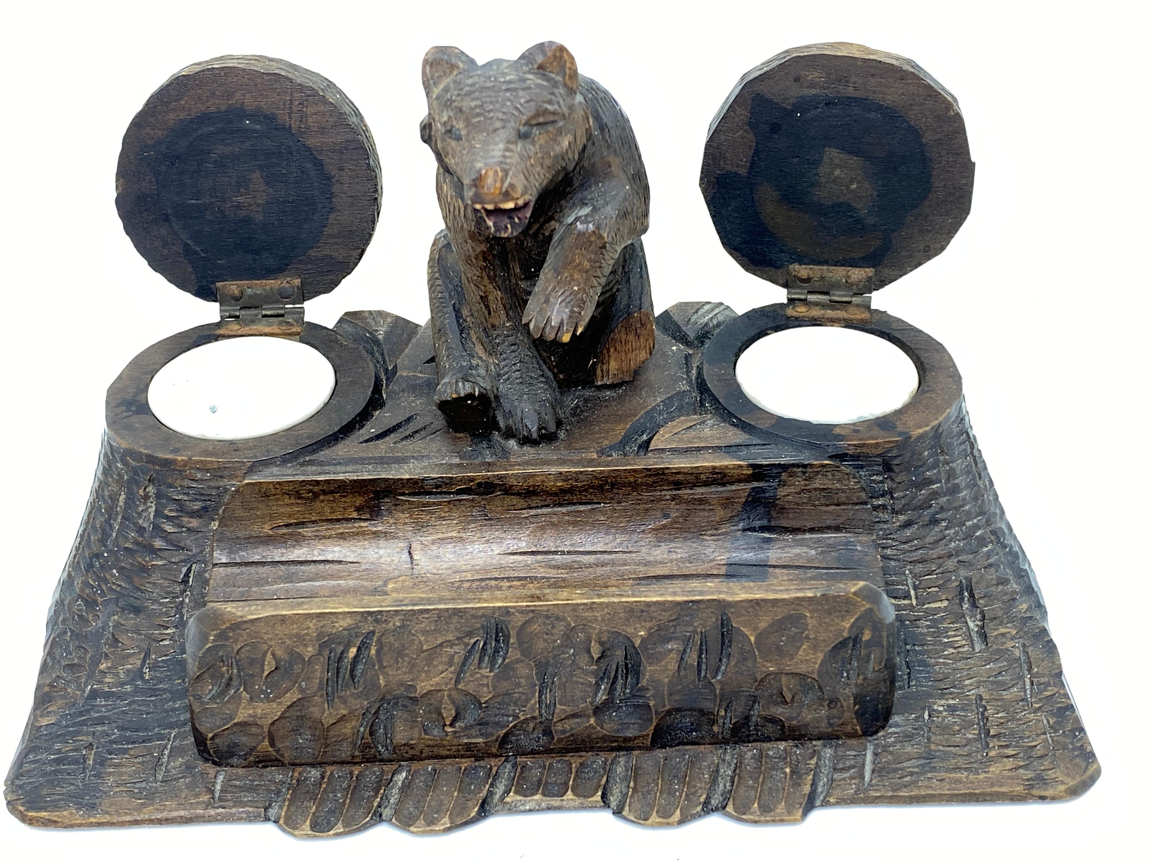 Classic 1890s Black Forest Brienz wood carved inkwell in form of a bear. Nice addition to your room or just for use it on your desk. Made of hand carved wood and glass eyes. Found at an estate sale in Vienna, Austria.