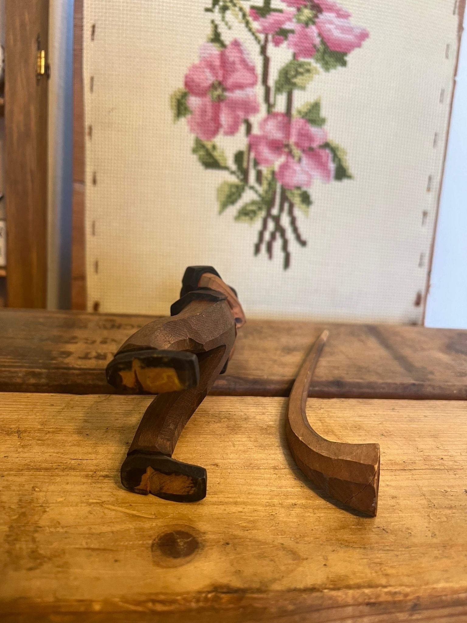 Wood Black Forest wood carving of man blowing a swiss horn For Sale
