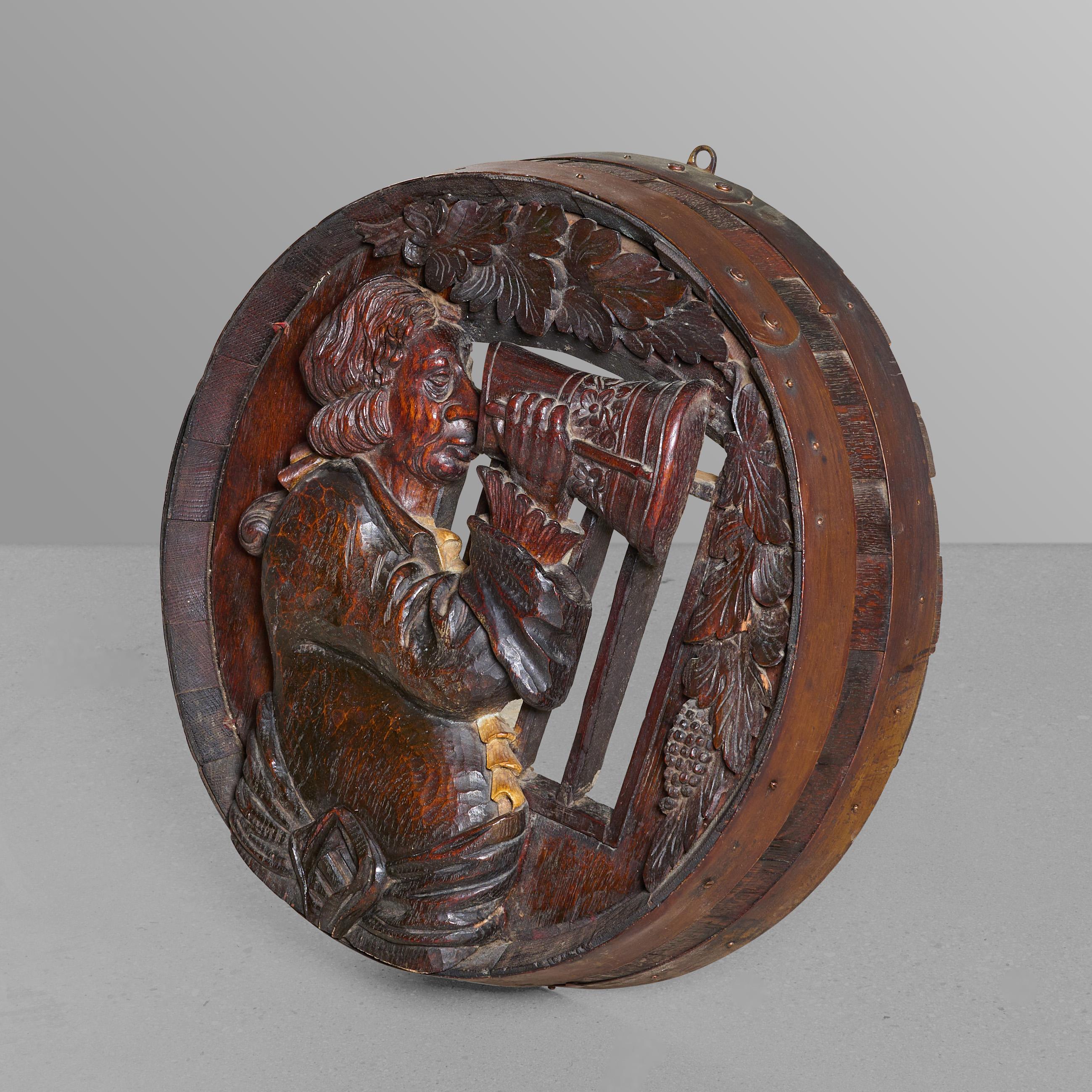 Heavily carved barrel head in the black forest style.