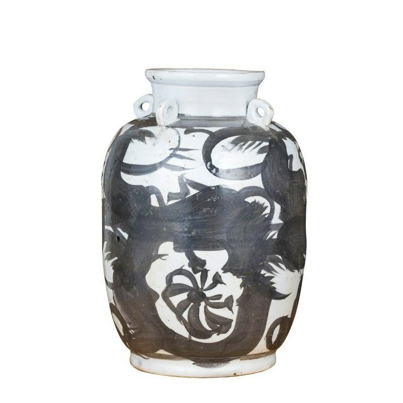 Black four loop handle jar twisted flower motif

The special antique process makes it looks like a piece of art from a museum. 
High fire porcelain, 100% hand shaped, hand painted. Distress, chips and other imperfections create great characters