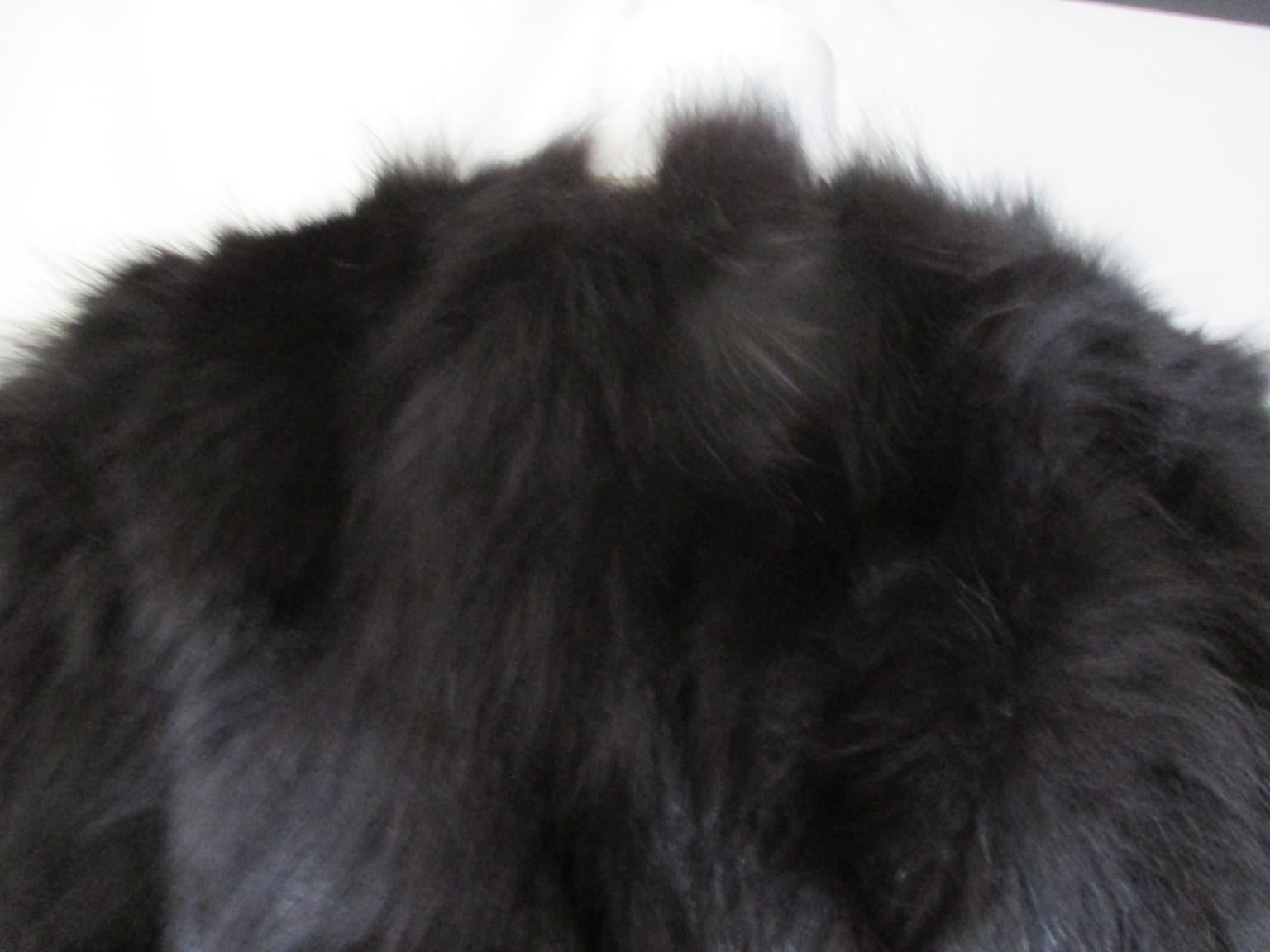 This beautiful jacket is made of very soft black fox fur and is light to wear.    

We offer more luxury fur, view our storefront.

Details:
Manufactured Toscana Pelleccerie, Italy
Black lining
2 pockets
3 closing hooks 
Appears to be about medium,