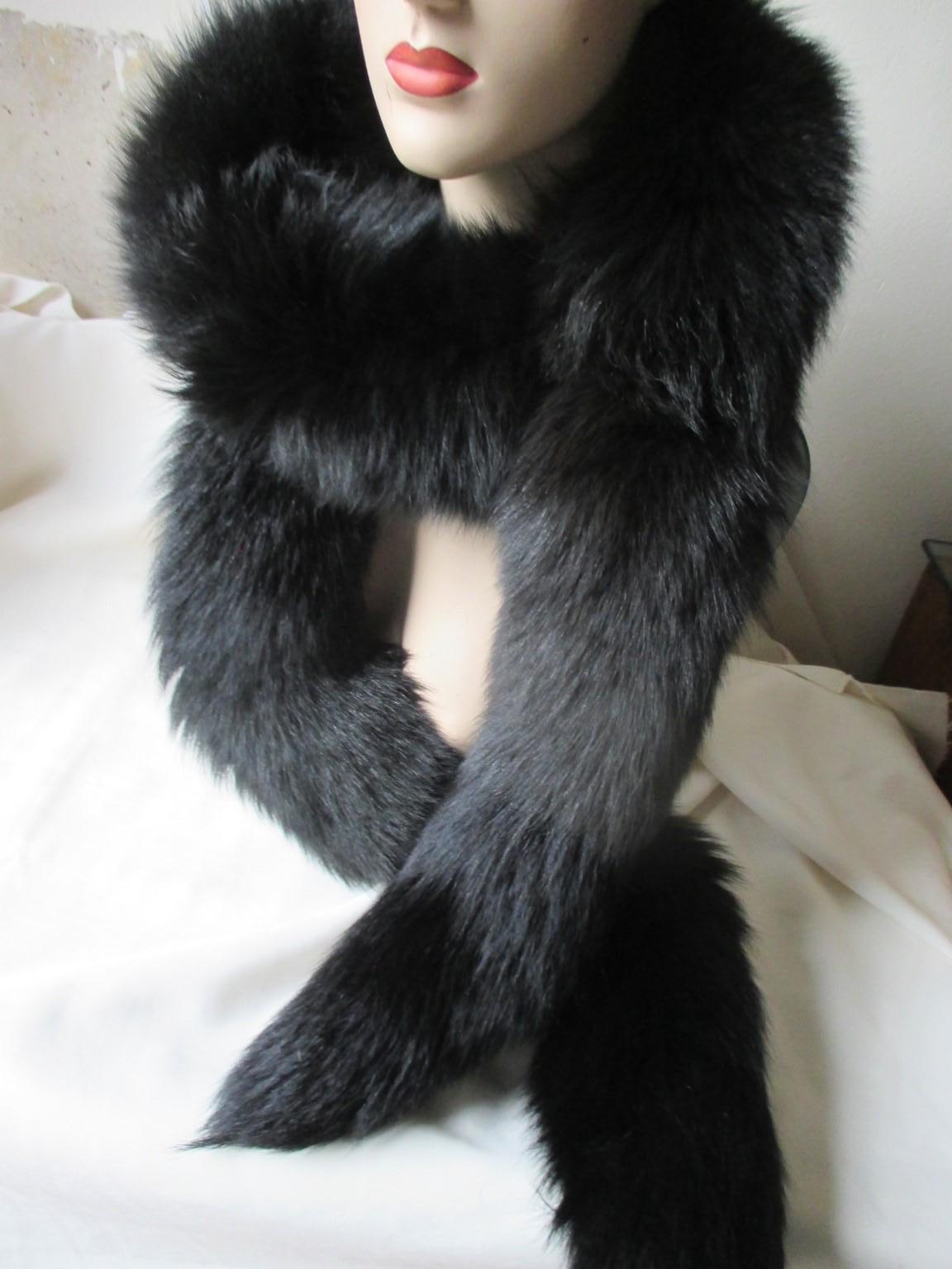 Very nice long black soft vintage fox fur stole.
Size 215 cm/ 84.64 inch

Please note that vintage items are not new and therefore might have minor imperfections.