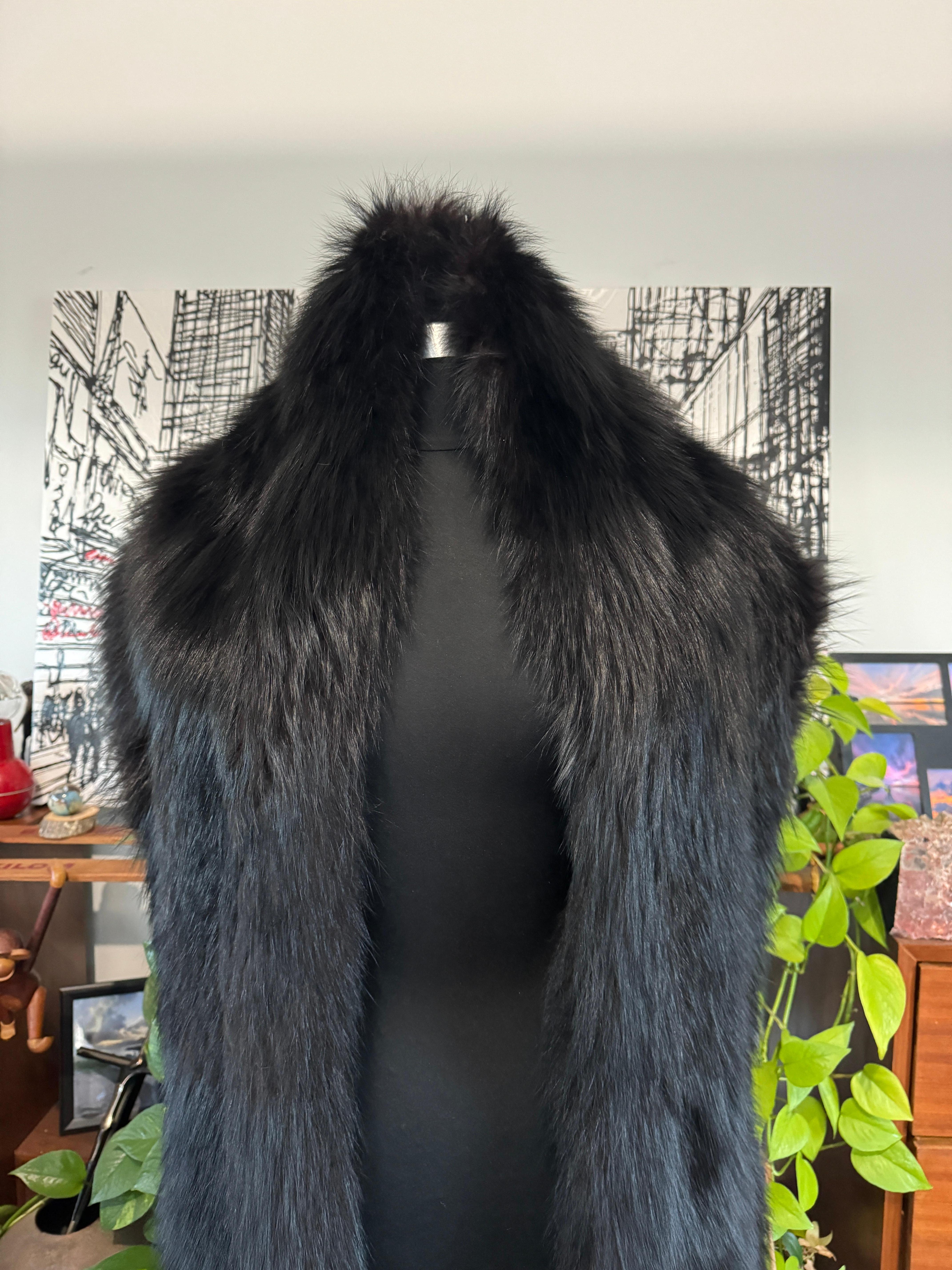 Long luscious Black Fox Wrap. Measuring 88 inches long x 11 inches at the widest. Versatile in style, wearing over a couture gown or over a jacket and jeans. Fur is supple.  We have been selling on this platform since 2013 so be sure to check our