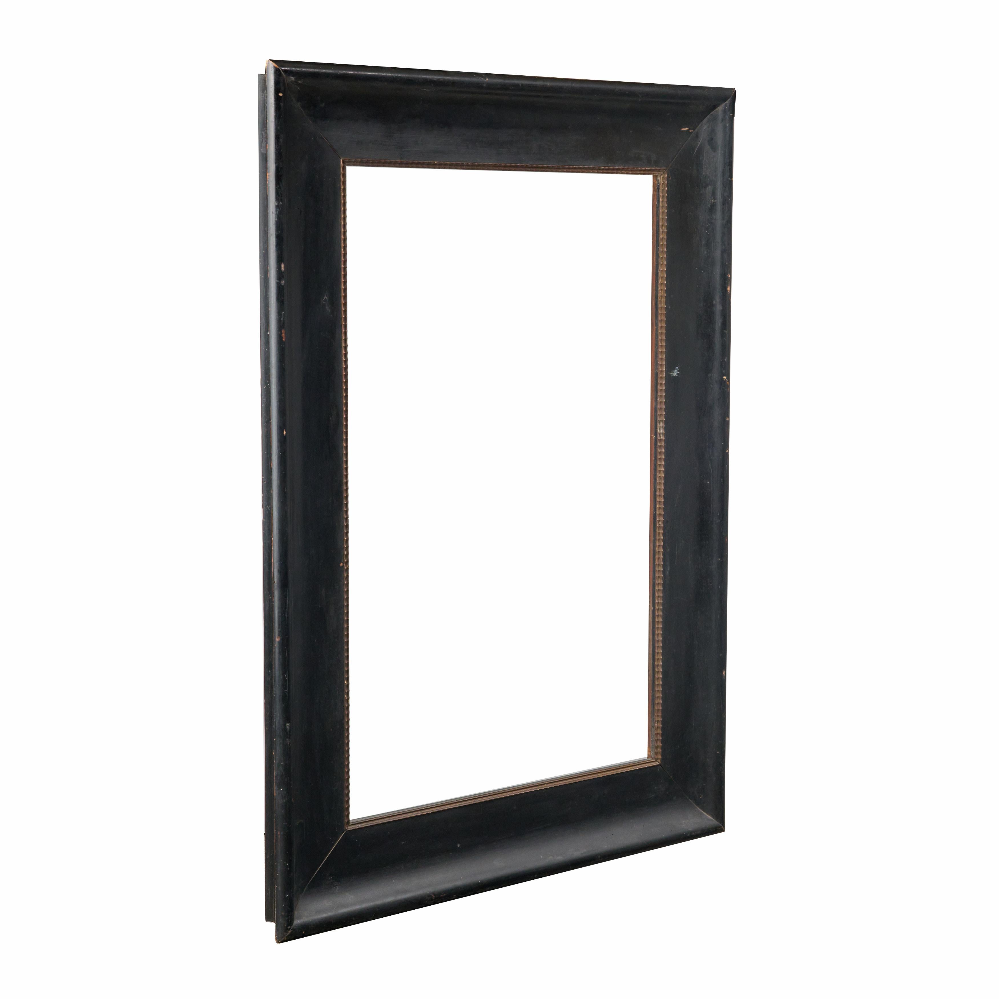 Black frame with simple border and original wood. Great condition. 
