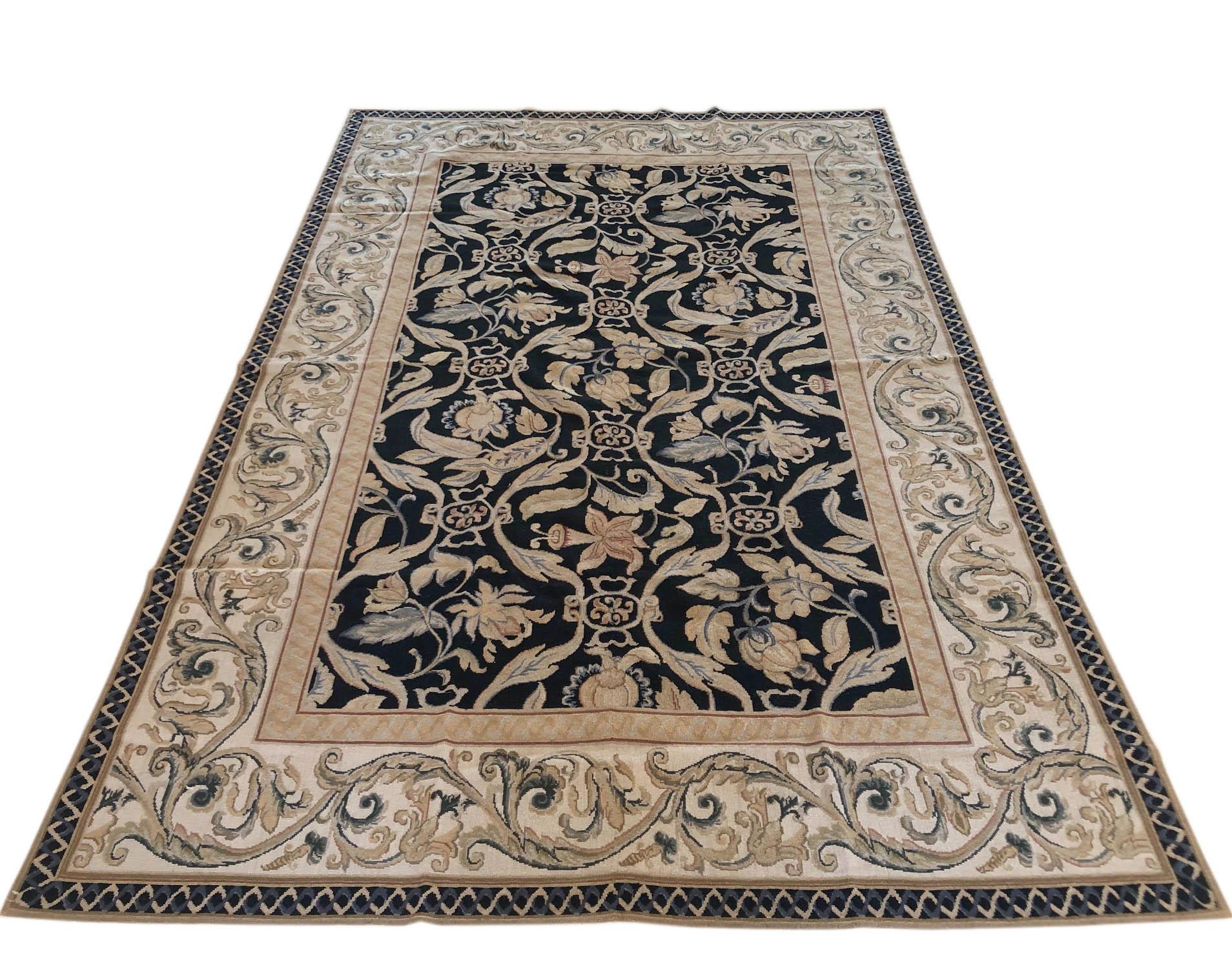 Chinese all over floral French leaf design needle point rug. The base color is black and the border is cream. The size is 5 feet 7 inches wide by 9 feet tall.