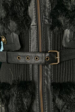 Black fur coat with ribbing edge and leather belt Just Cavalli