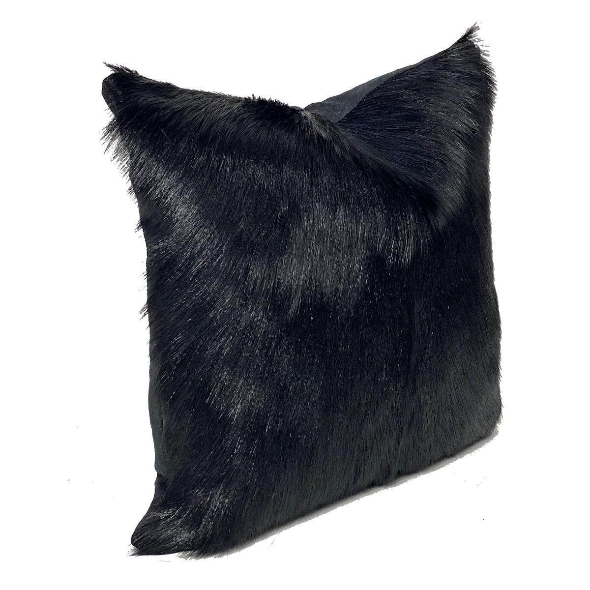 Inject refined textures to your space with this luxurious and contemporary black fur pillow hand-crafted from genuine goatskin.

With irresistible and shiny black fur, makes each goatskin pillow remarkably beautiful, preserving the natural and