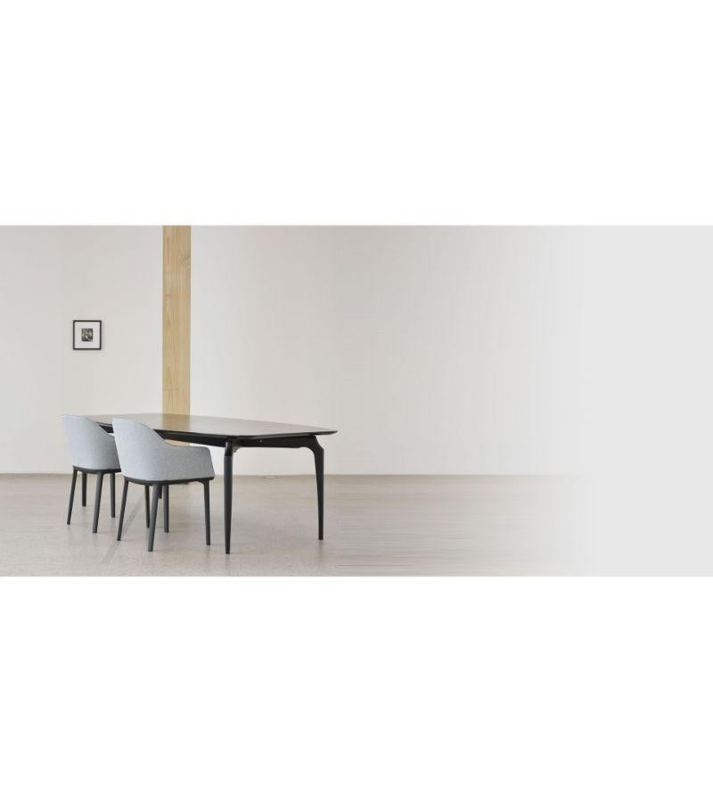 Black Gaulino table by Oscar Tusquets
Dimensions: D 120 x W 300 x H 74 cm 
Materials: Solid structure in walnut wood, varnished nature effect (for only the version in 240cm), or solid ash wood with three optional finishes: natural varnished,