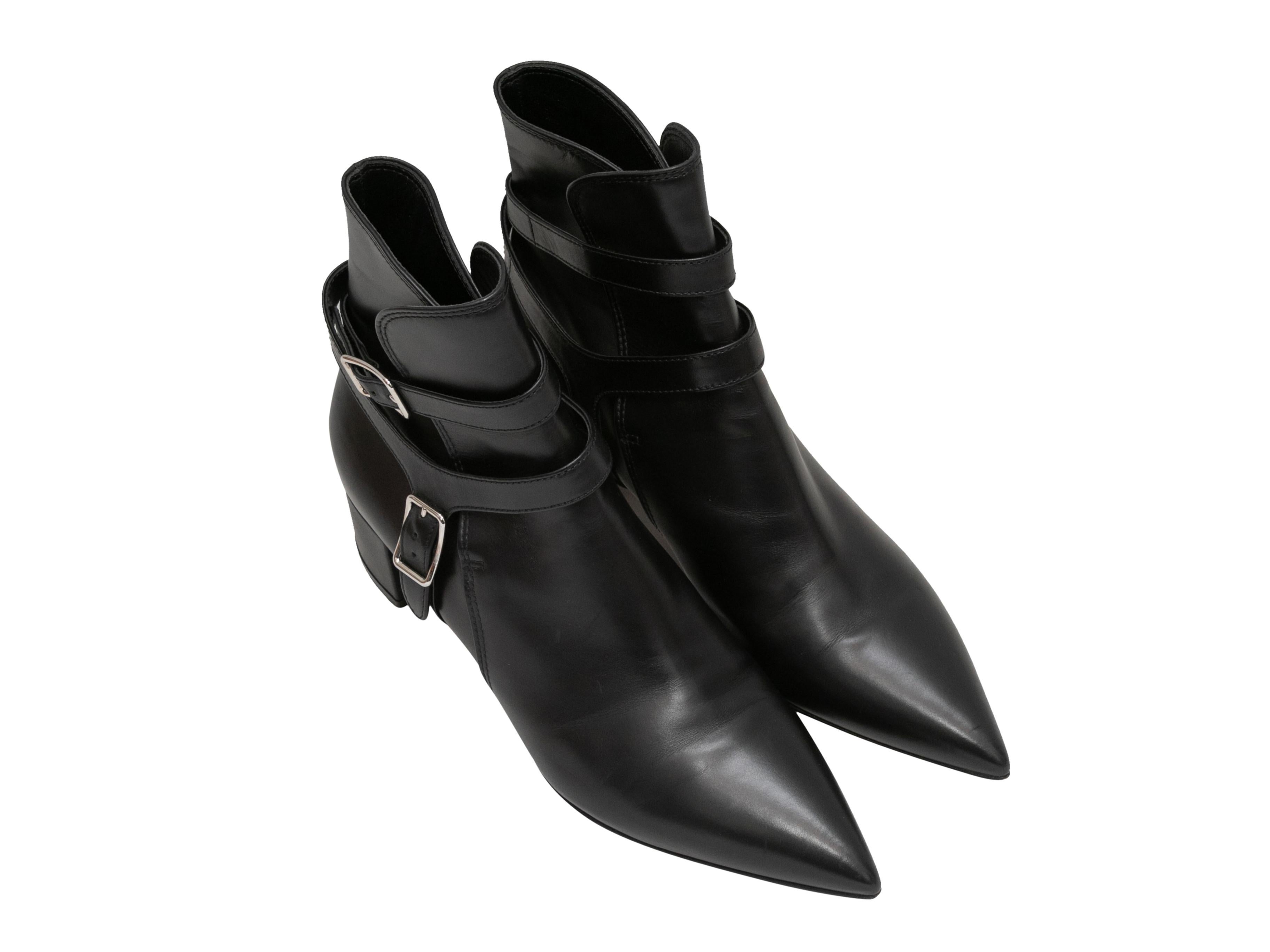 Black leather pointed-toe ankle boots by Gianvito Rossi. Block heels. Buckle accents at shafts. 5
