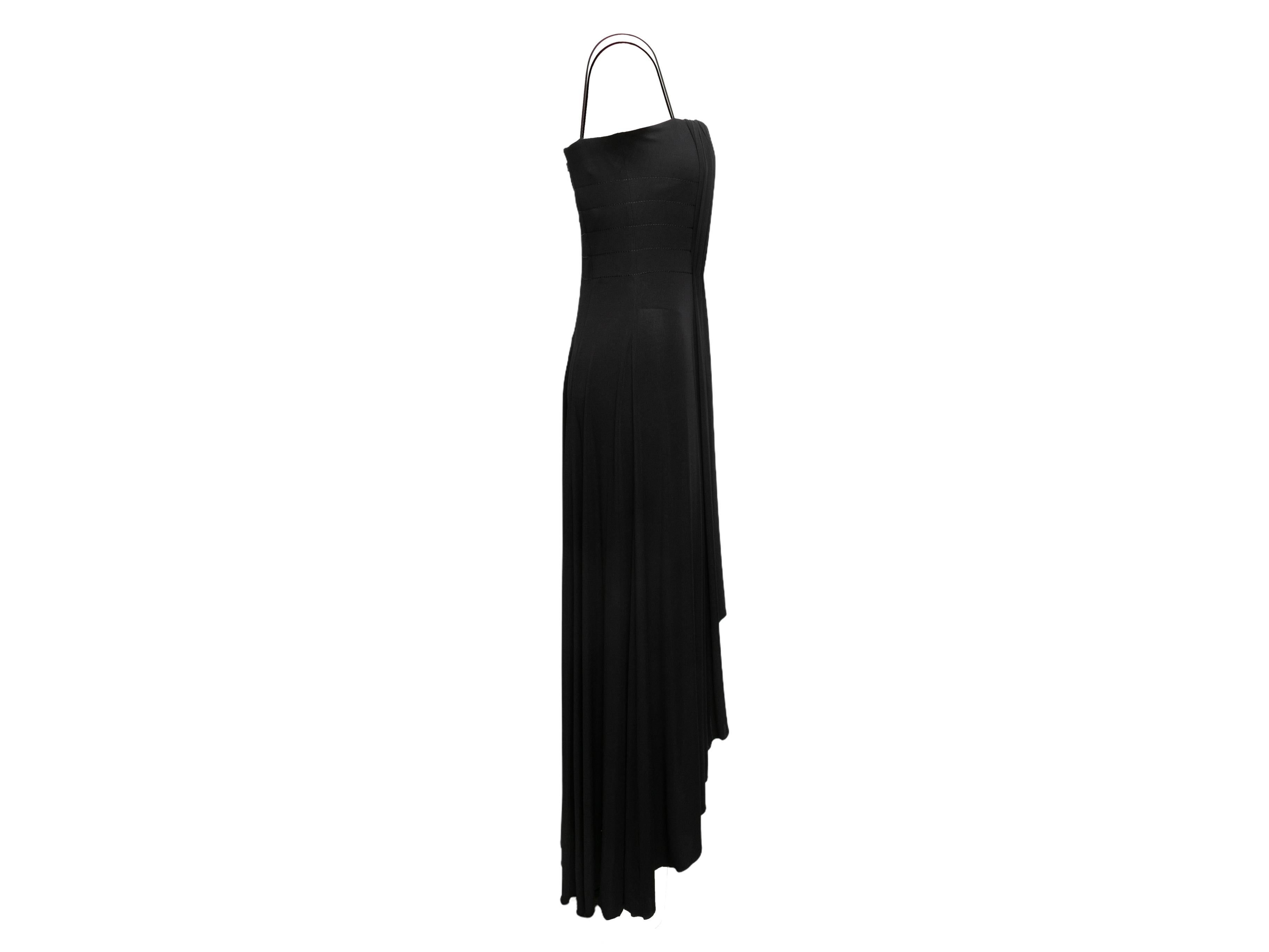Black long sleeveless gown by Giorgio Armani. Square neckline. Narrow straps. Draping at front. Zip closure at back. 30