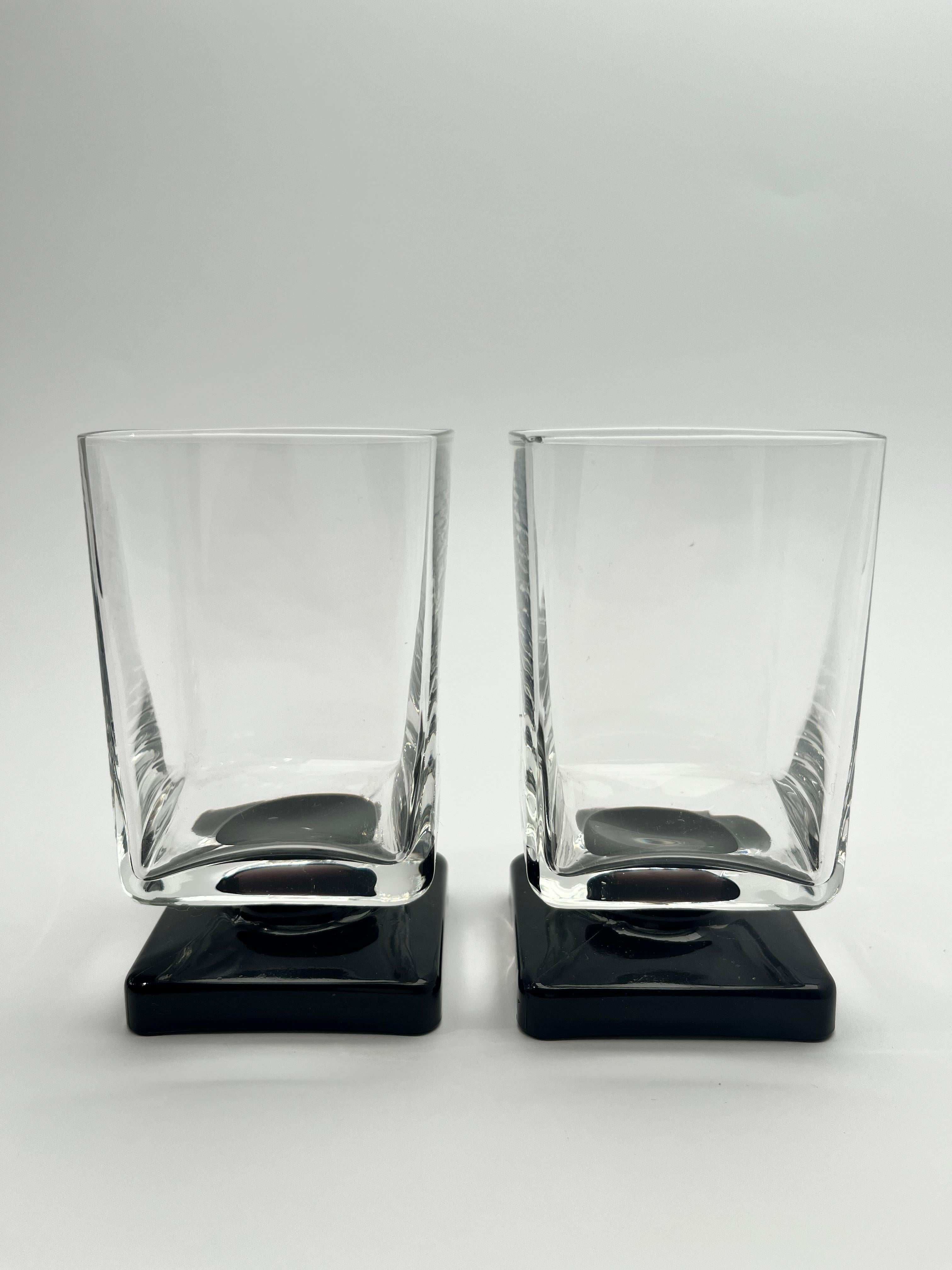 Set of 11 Black glass Square Footed Cocktail Glasses. This series was a part of promotional campaign for Amaretto Di Saronno Signed by Bormioli. Made in Italy, 1970s and 1980s. Elegant glasses, ethernal design. Mint condition.

Dimensions

Height: