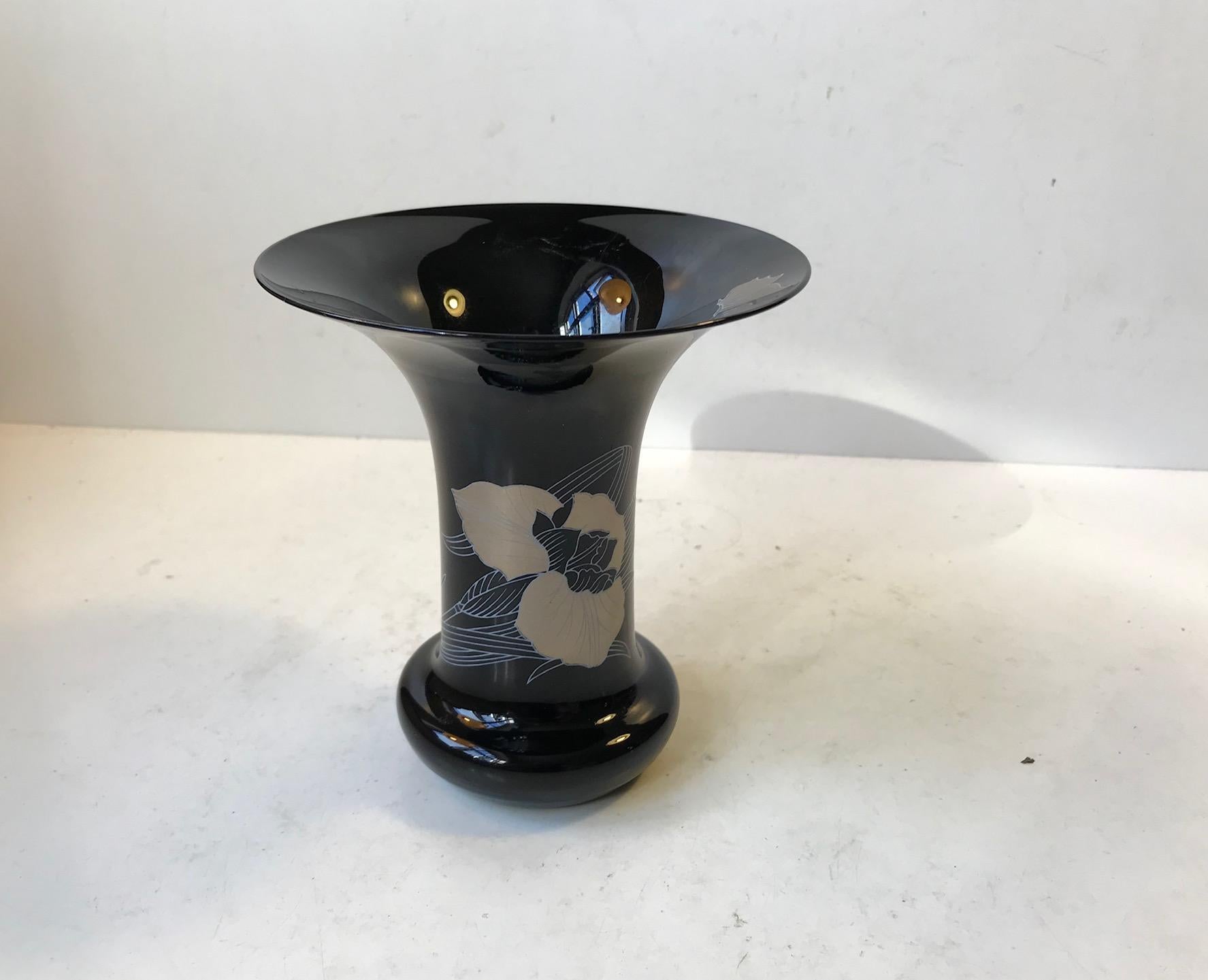 Delicate black glass vase decorated with gold flowers by Leonard Paris. It was manufactured in Germany by Hutschenreuther during the 1980s.