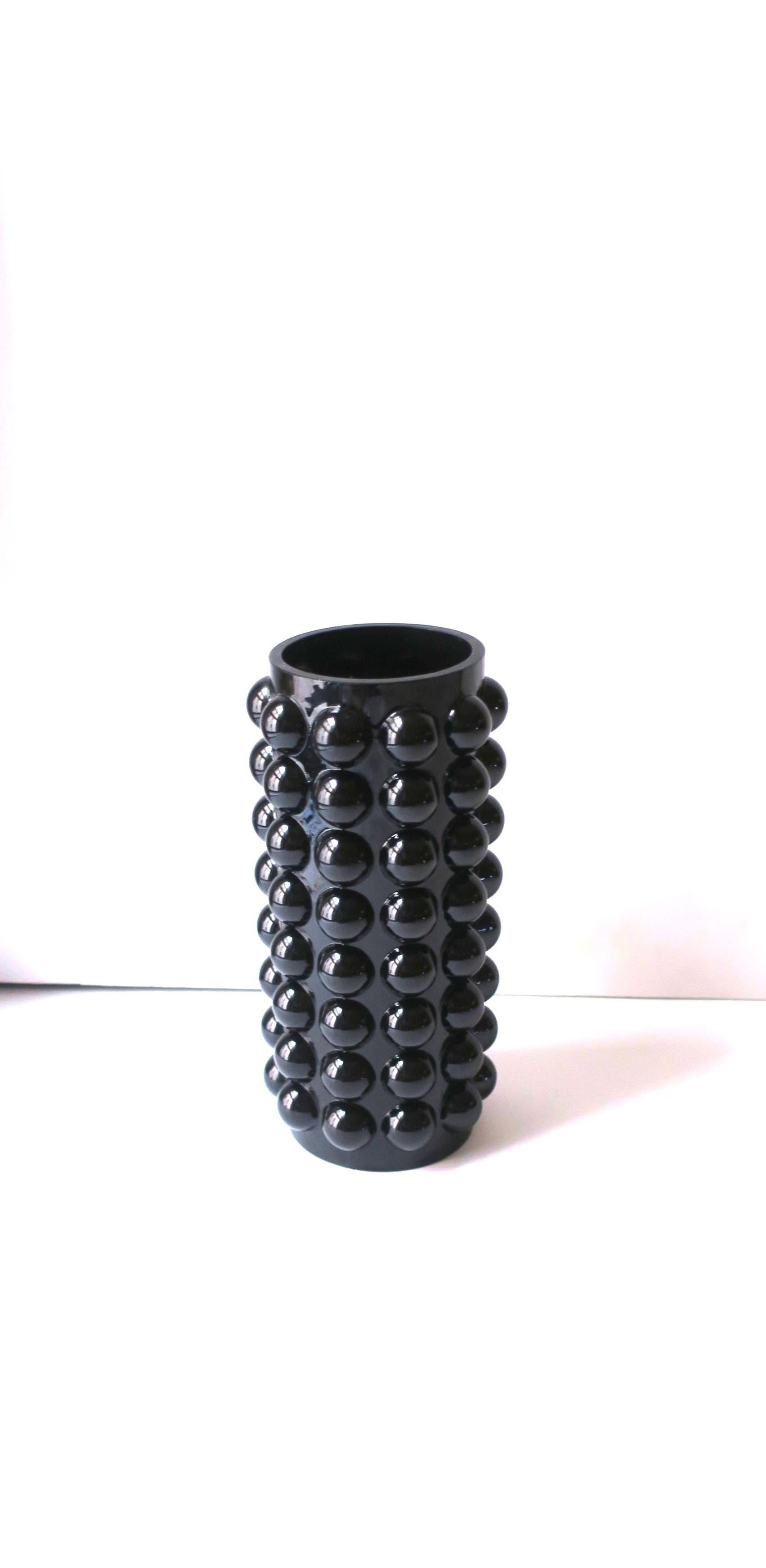 A black glass vase with ball sphere design, in the Modern-Deco style. A beautiful piece with or without flowers, as shown. Dimensions: 4