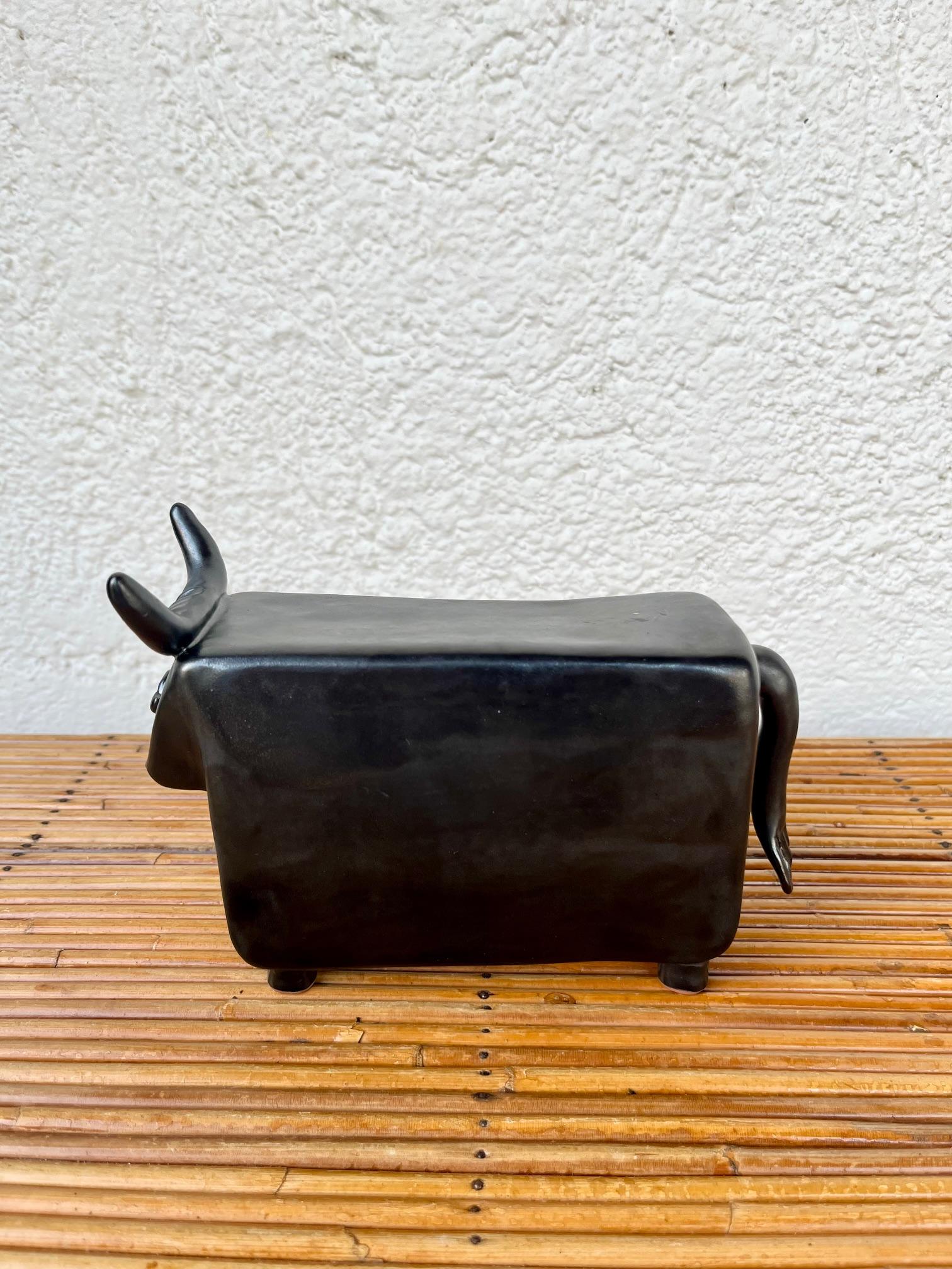 Robert and Jean Cloutier Ceramic bull sculpture.
 Black glazed ceramic.
Excellent condition.
 Signed  Cloutier RJ.
Circa 1960, France. 

 Robert and Jean Cloutier 1930-2008 ans 1930-2015 )  were twin brothers, collaborating as artists and