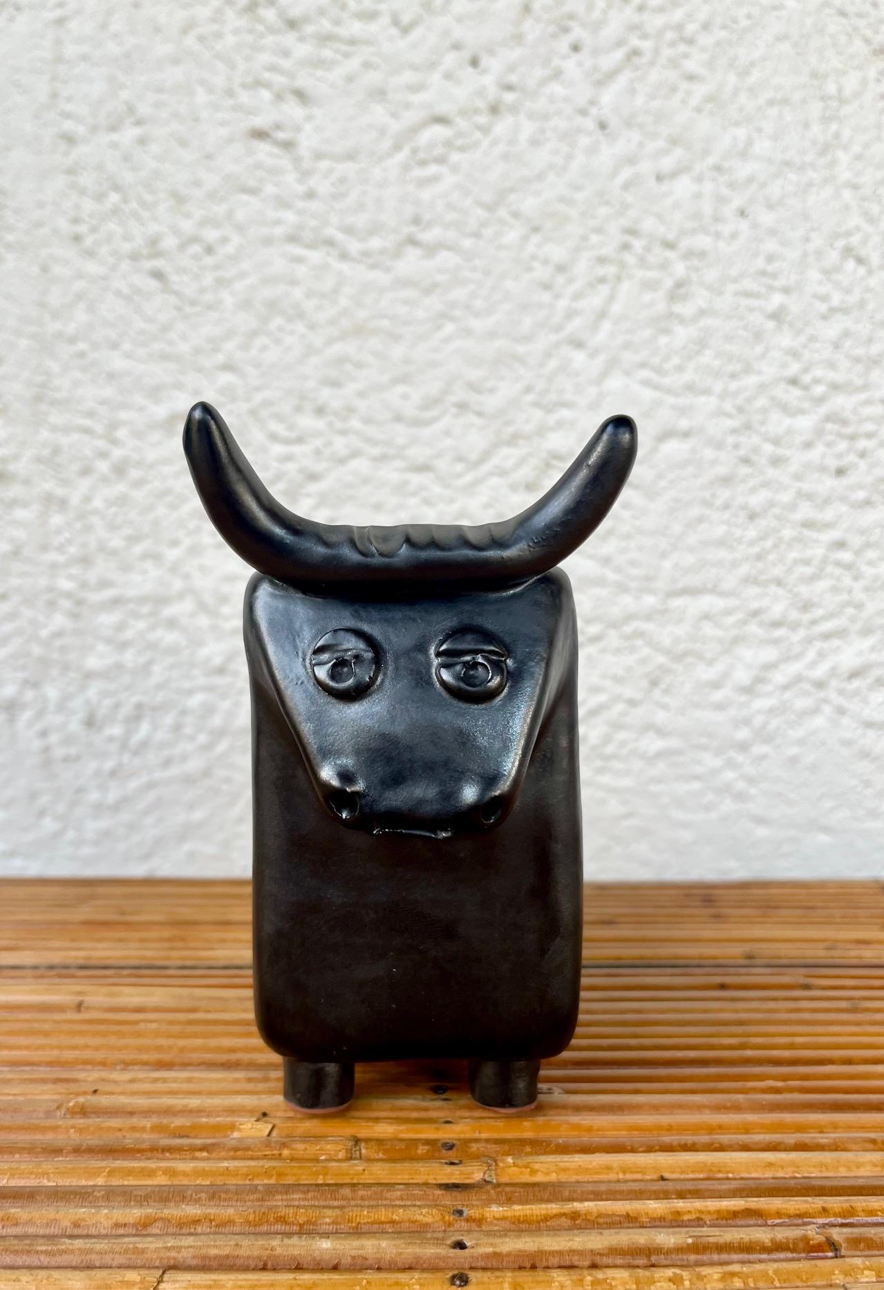 Glazed black glazed ceramic bull by Cloutier 1960's