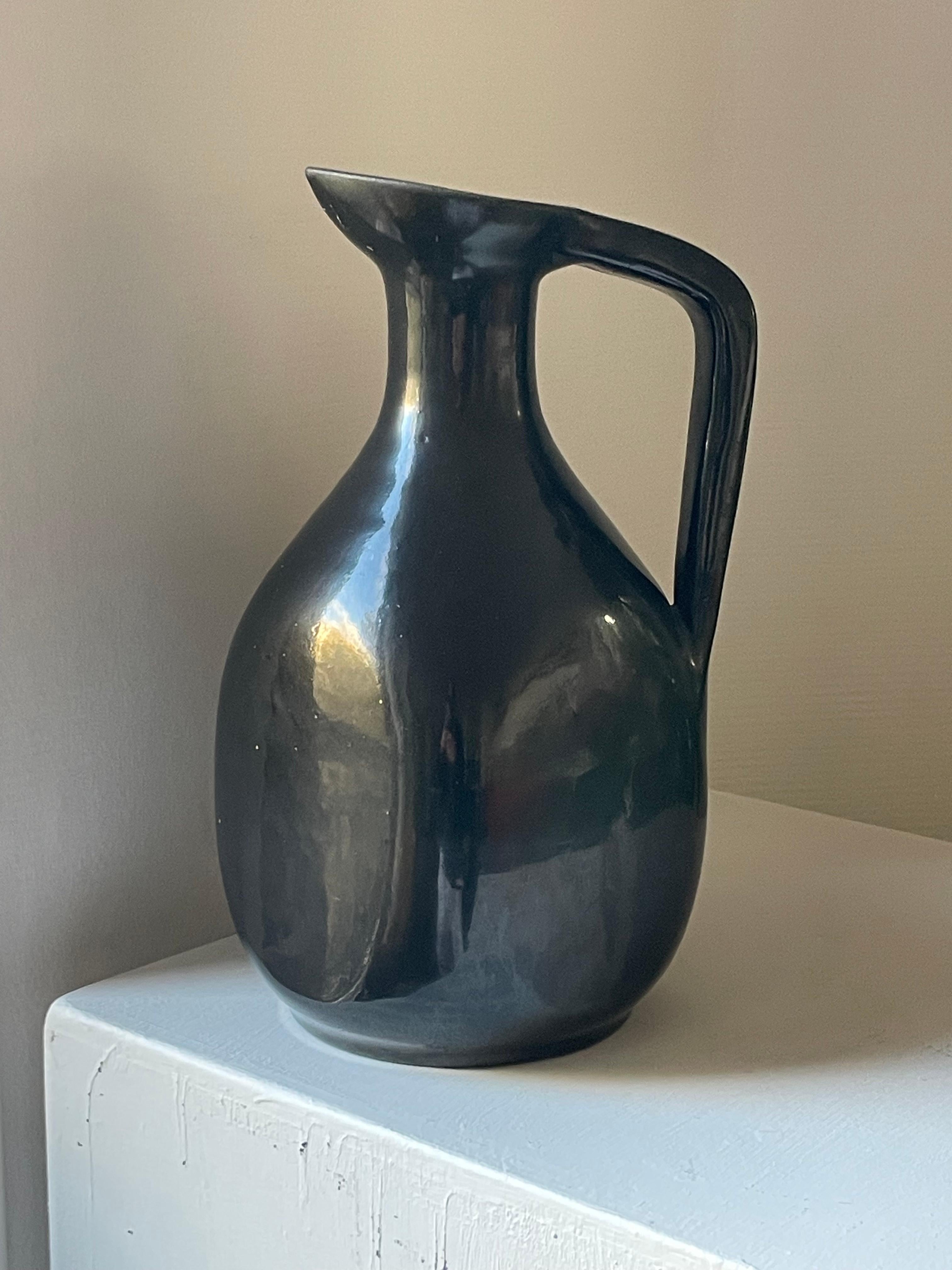 French Black glazed ceramic pitcher by Accolay potters, circa 1950 For Sale
