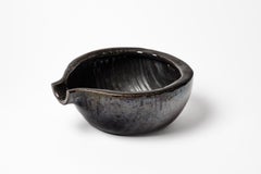 Black glazed ceramic pouring bowl by Accolay, circa 1960-1970.
