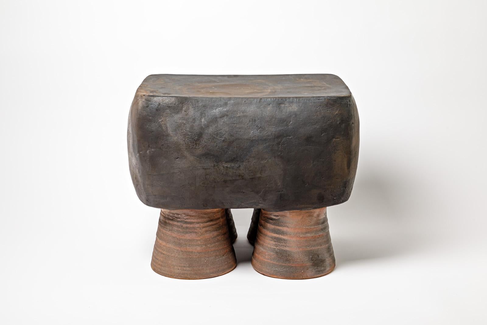 Black glazed ceramic stool or coffee table by Mia Jensen. 
Artist signature under the base. 2023.
H : 16.5’ x 14.2’ x 19.3’ inches.