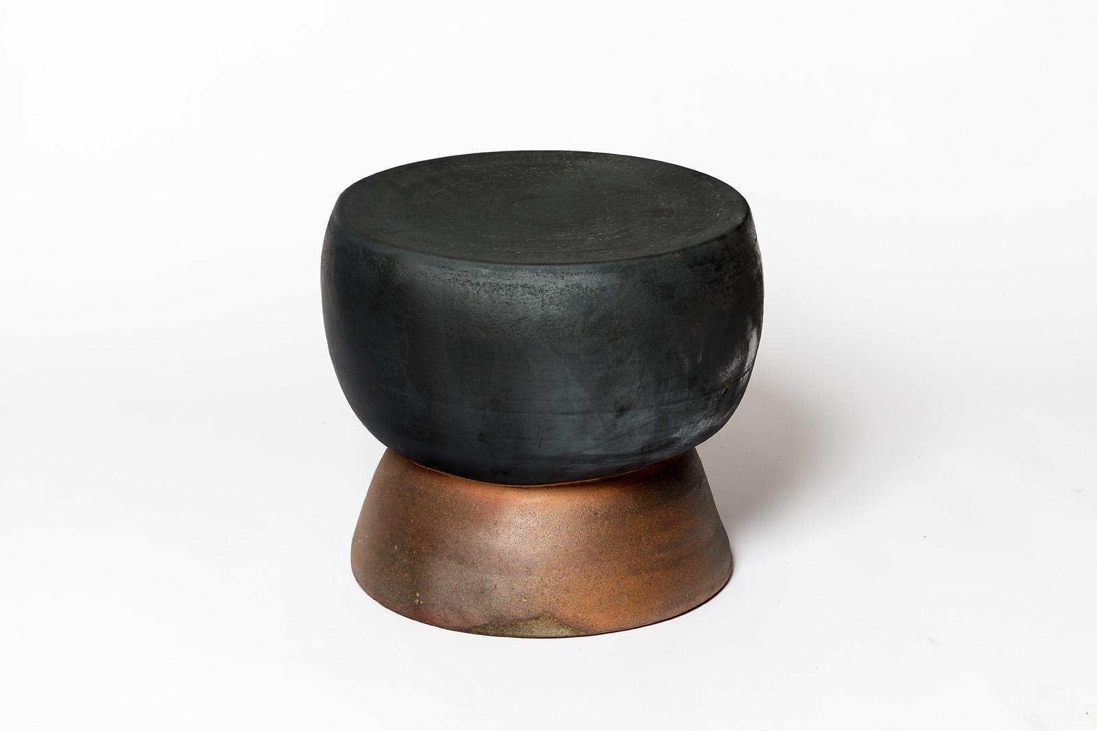 Black glazed ceramic stool or coffee table by Mia Jensen. 
Artist signature under the base. 2024.
H : 13.8’ x 14.5’ inches.