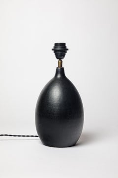 Black glazed ceramic table lamp in the style of Georges Jouve, circa 1950-1960