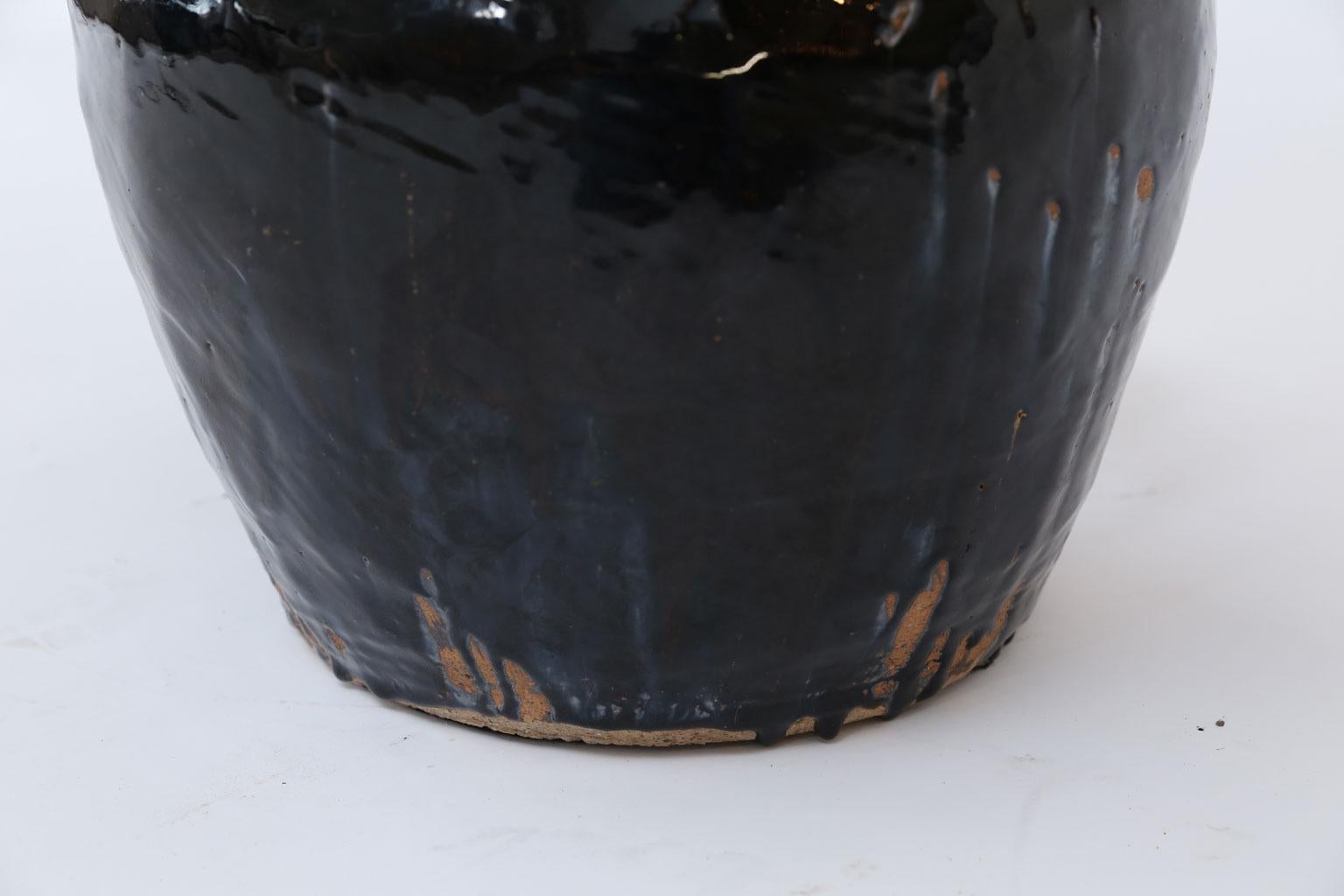 Black glazed terracotta table lamp, newly wired for use within the USA. Custom lamp from vintage Korean ceramic vase glazed in a iridescent black. Nice large proportions. Includes complementary custom coolie-shape Belgian linen shade (measurements