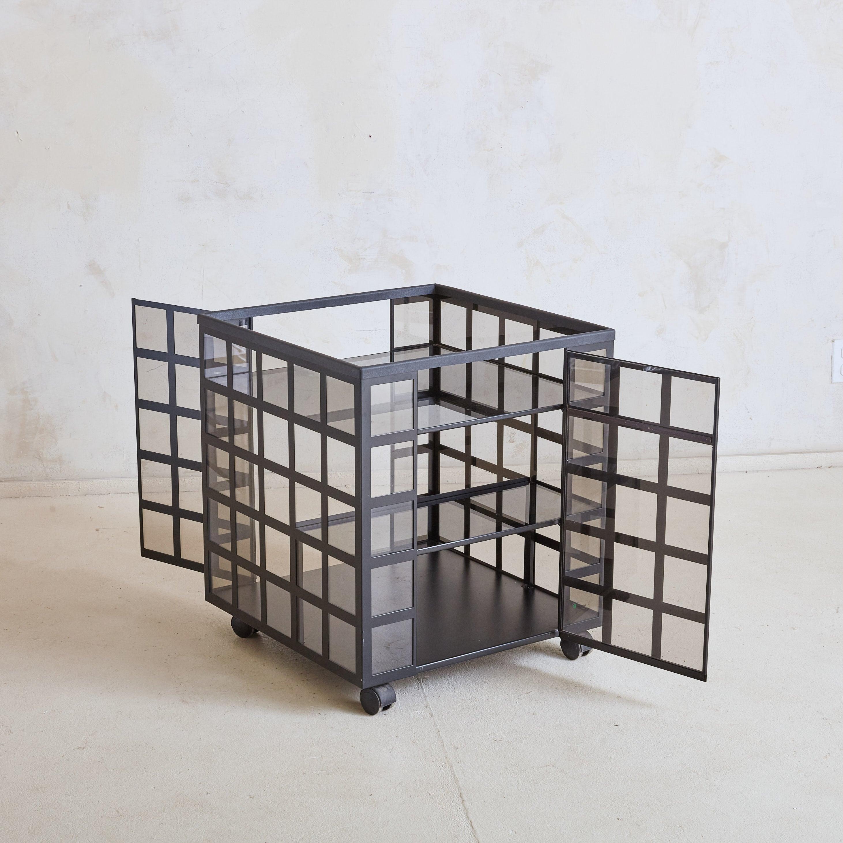 The “Go Go” trolley, designed by Anna Anselmi for Bieffeplast in 1978, is a permanent exhibit at MoMA in Philadelphia and Munich. The Postmodern design is constructed of lacquered stamped sheet metal and crystal plates. This bar features gray smoked