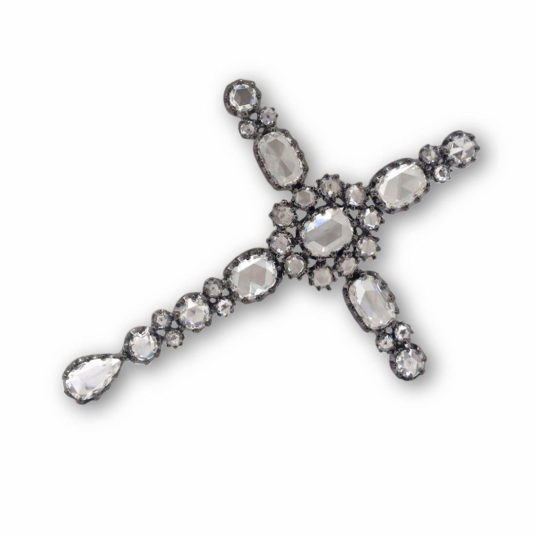 A chic cross pendant crafted in 18 karat black gold. The pendant is set with dazzling mixed cut and round brilliant diamonds of an estimated 3.5 total carat weight. The pendant measures 2.25 inches in length and at its widest point, 1.65 inches in