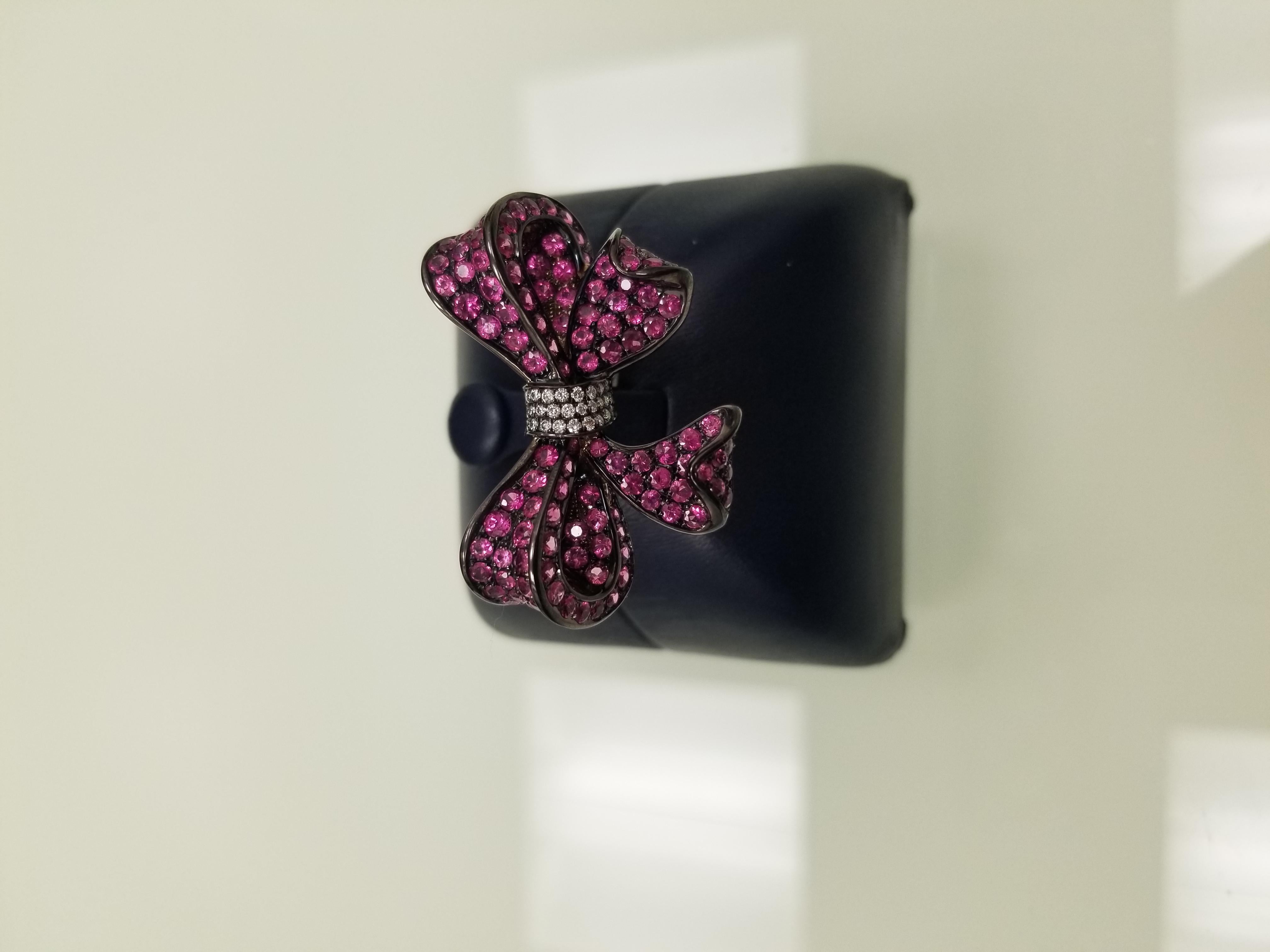 This ring will surely help you unwrap any presents one of a kind made with 18 carrot gold oxidized to make it black is that with find ruby's and diamonds. This ring will surely be one of her favorite pieces to wear on night outs. 

